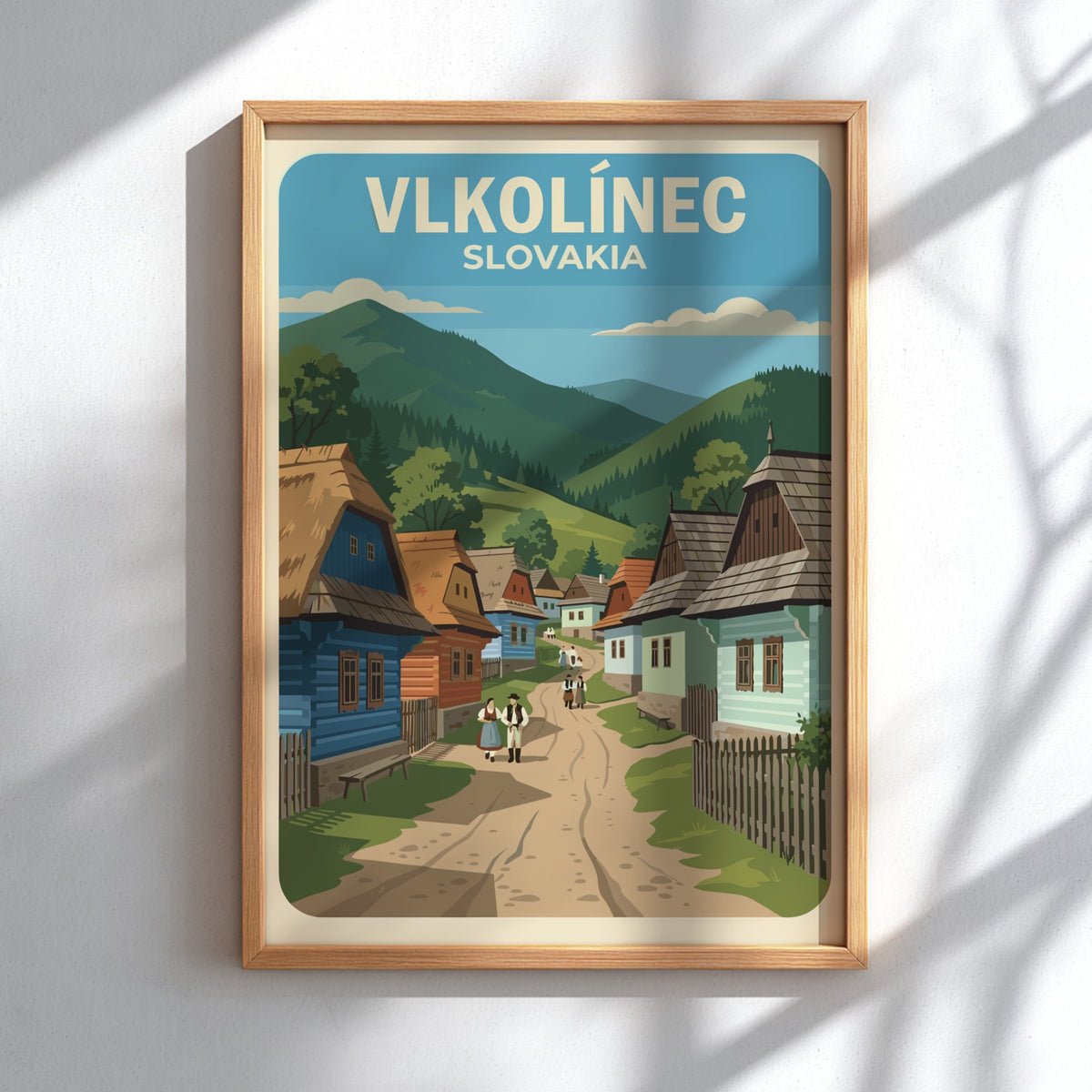 Poster featuring colourful timber houses in Vlkolinec Slovakia with rolling green mountains behind