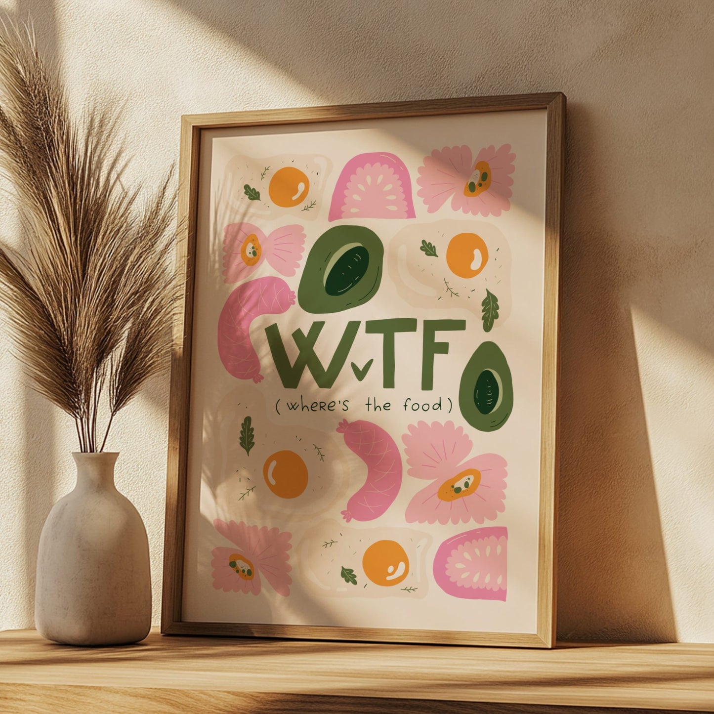 Framed artwork with colorful text and illustrations on a wooden shelf.