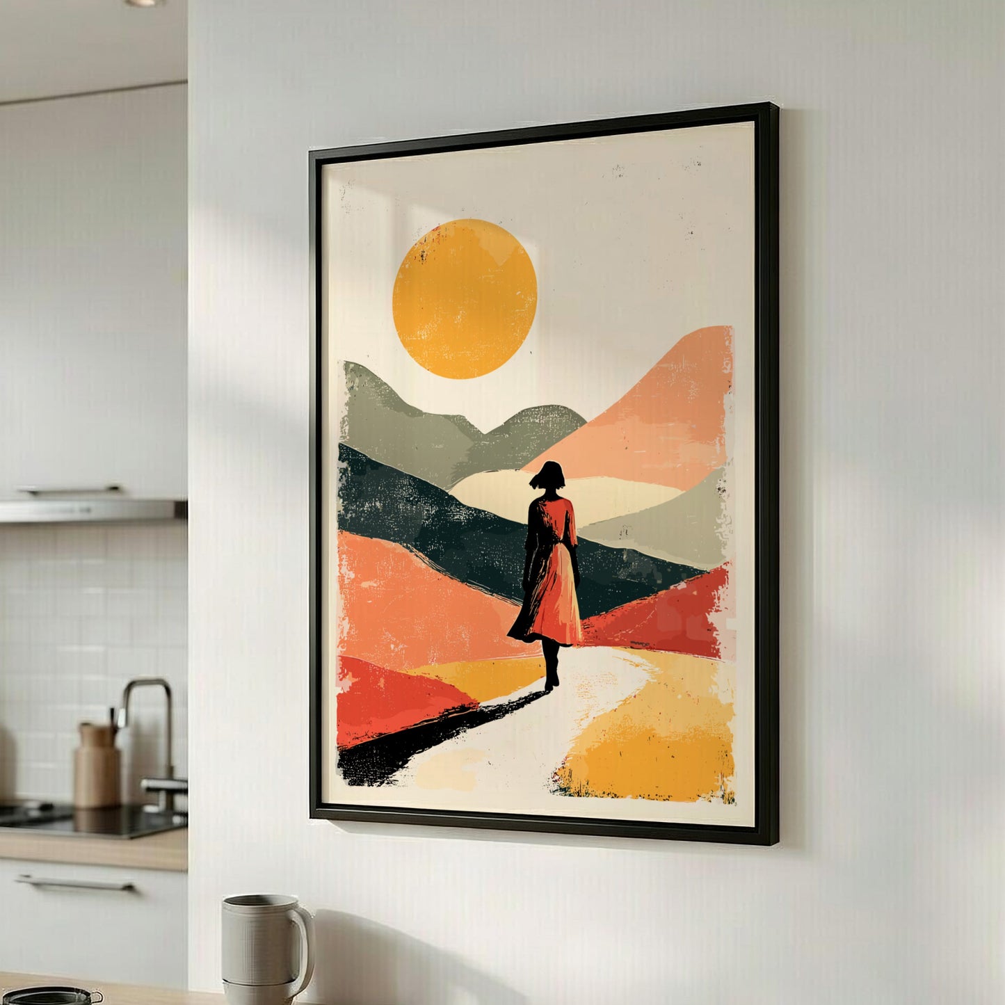 Framed abstract artwork of a person in a red dress against a colorful landscape with a yellow sun, hanging in a kitchen.