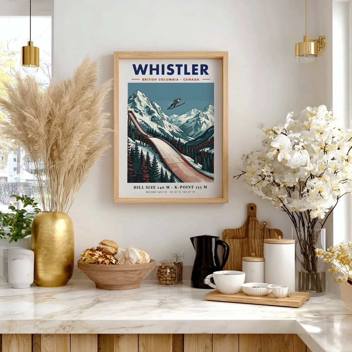 Poster of a ski jumper in flight above snowy Whistler mountains and trees.