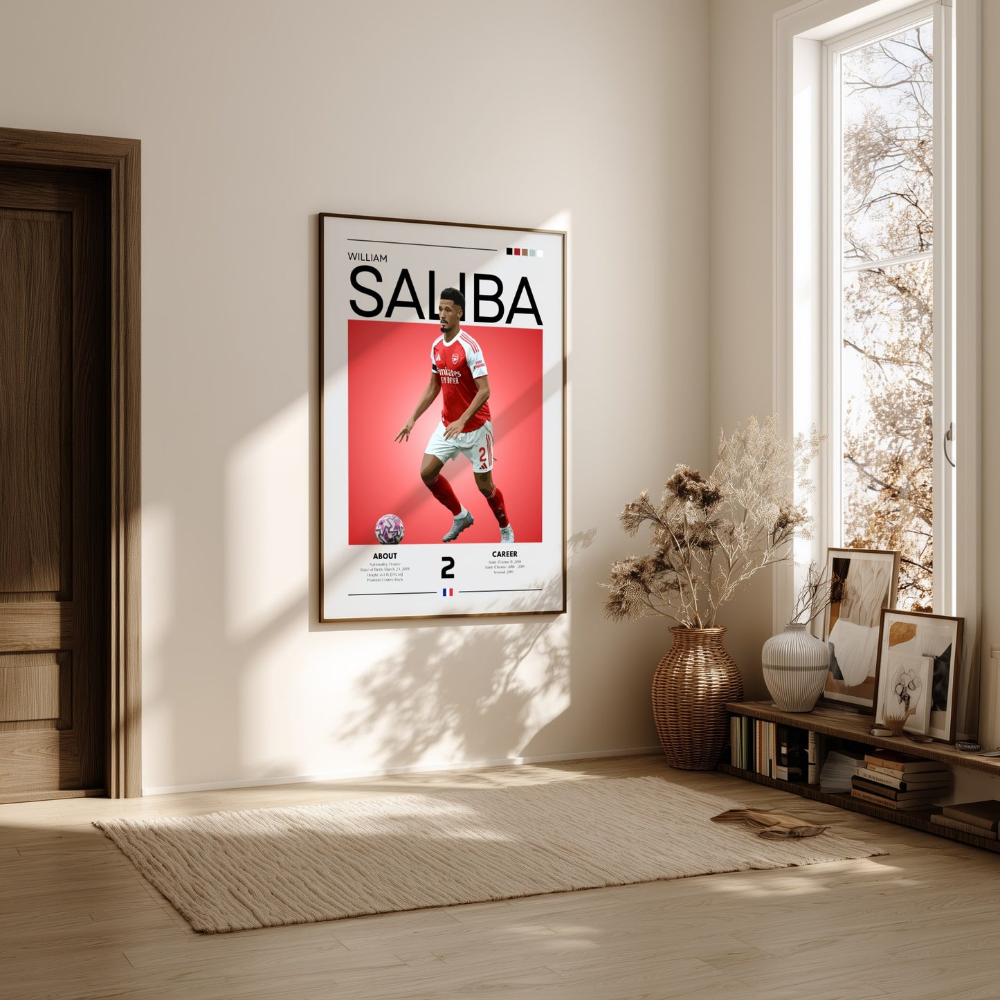 Framed sports poster of a player on a wall in a bright room with natural light.