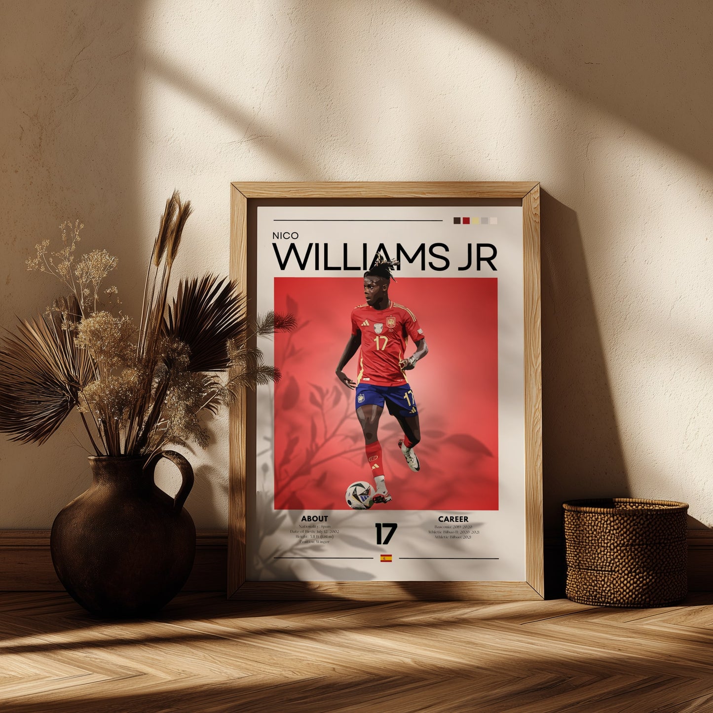 Framed sports poster of a player named Williams Jr. on a wooden shelf with decorative plants.