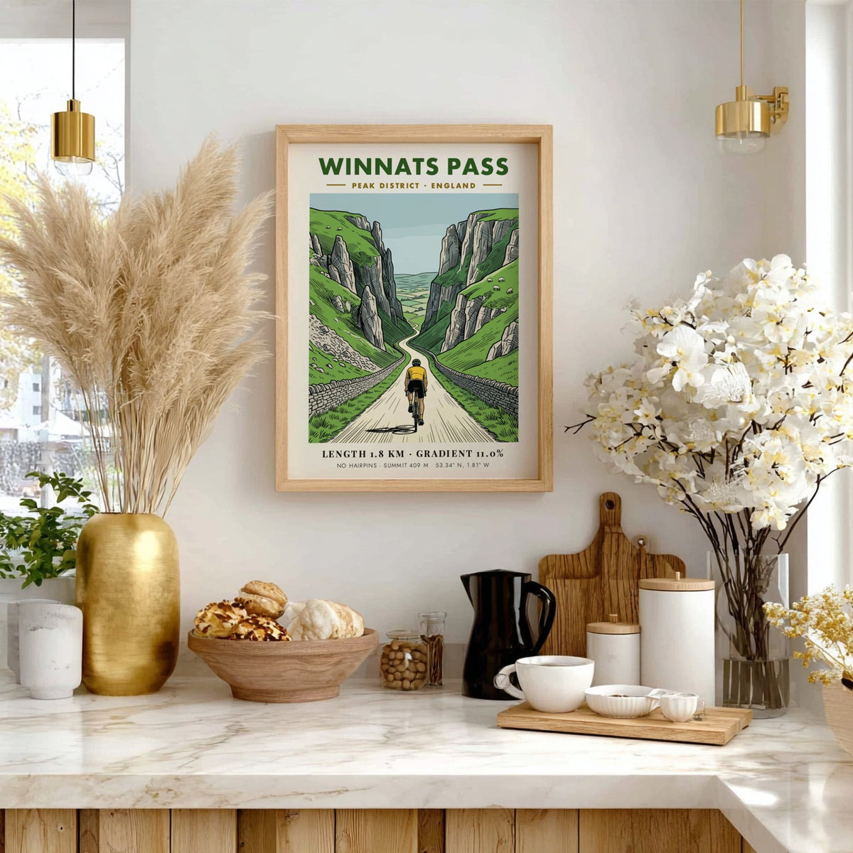 Poster of a cyclist climbing the steep winding road through Winnats Pass cliffs