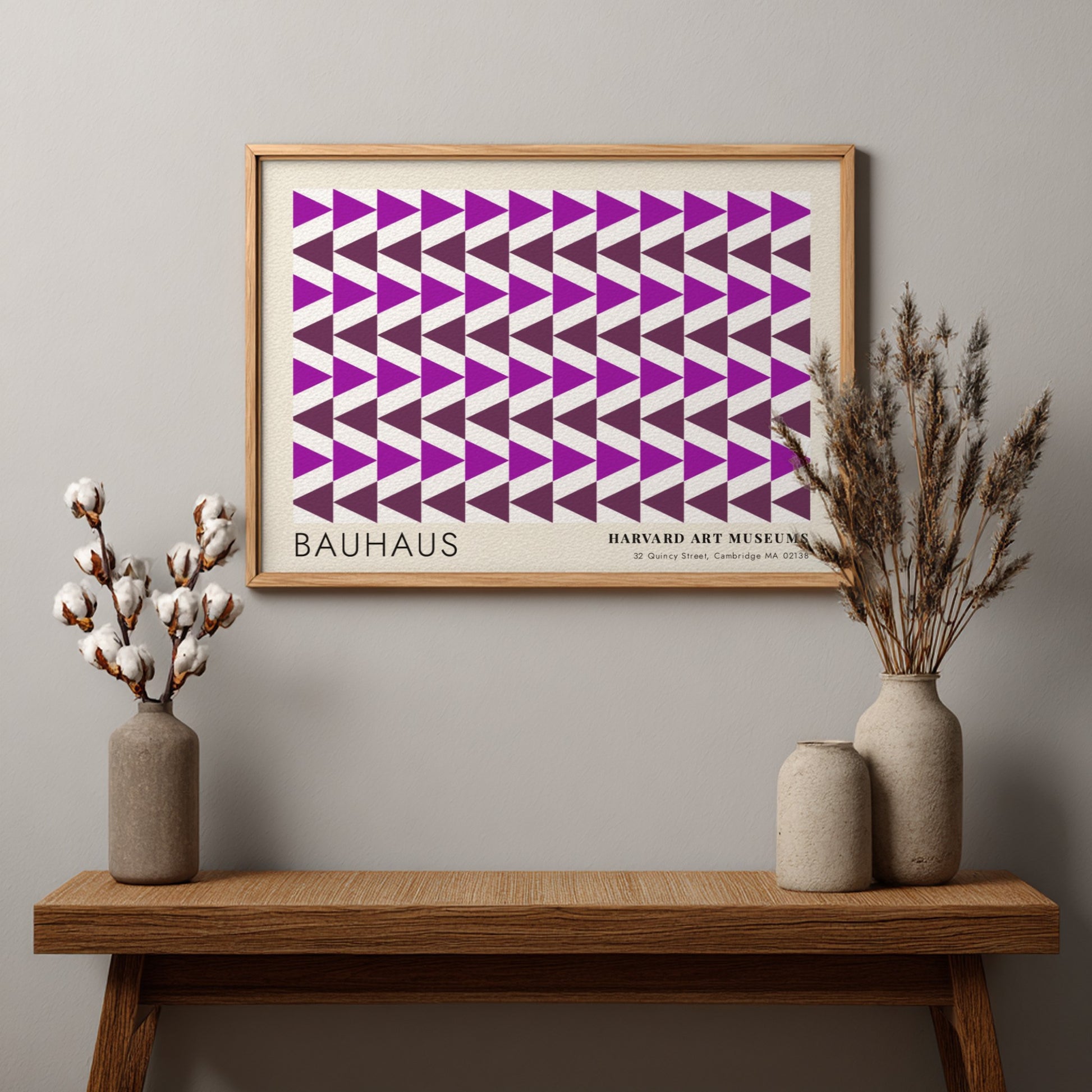 Wall art poster featuring repetitive purple geometric triangles and Bauhaus Harvard Art Museums text.