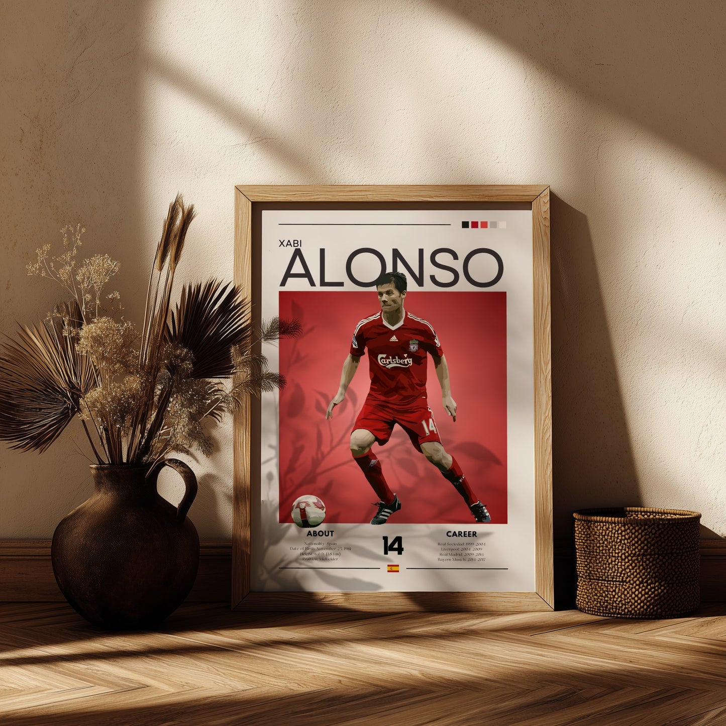 Framed poster of a soccer player in a red uniform on a wooden shelf with decorative plants.