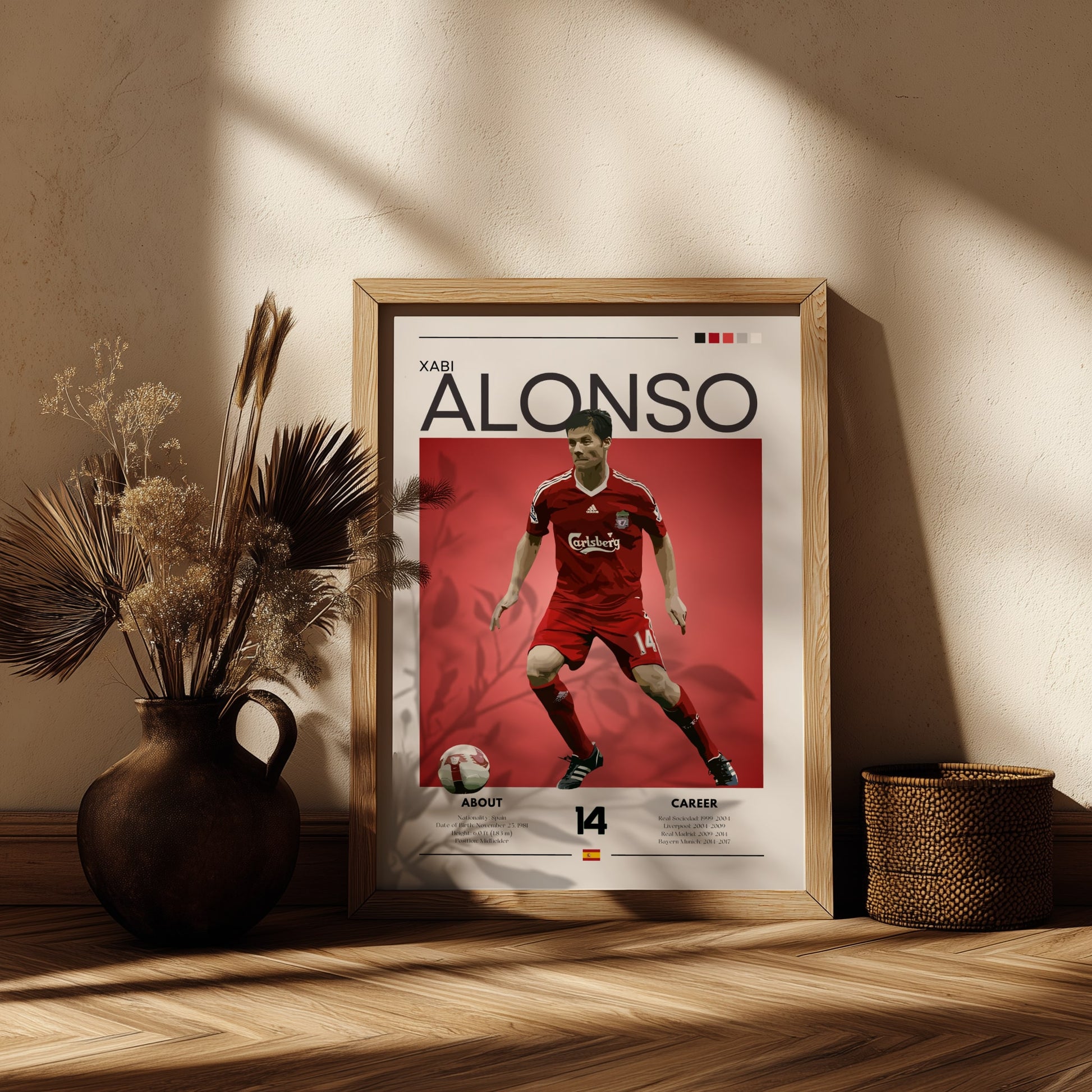Framed poster of a soccer player in a red uniform on a wooden shelf with decorative plants.
