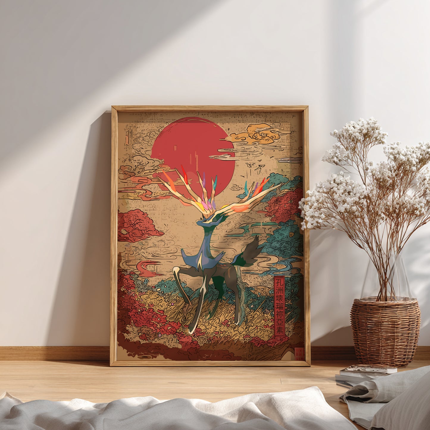 Framed abstract artwork of Xerneas Pokemon on a wall with a vase of dried flowers below.
