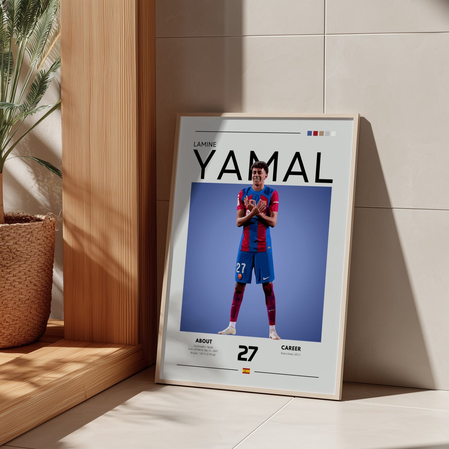 Framed poster of a soccer player with 'YAMAL' on it, leaning against a wall.