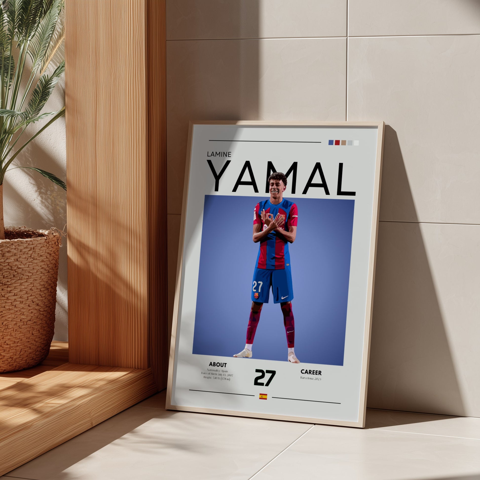Framed poster of a soccer player with 'YAMAL' on it, leaning against a wall.