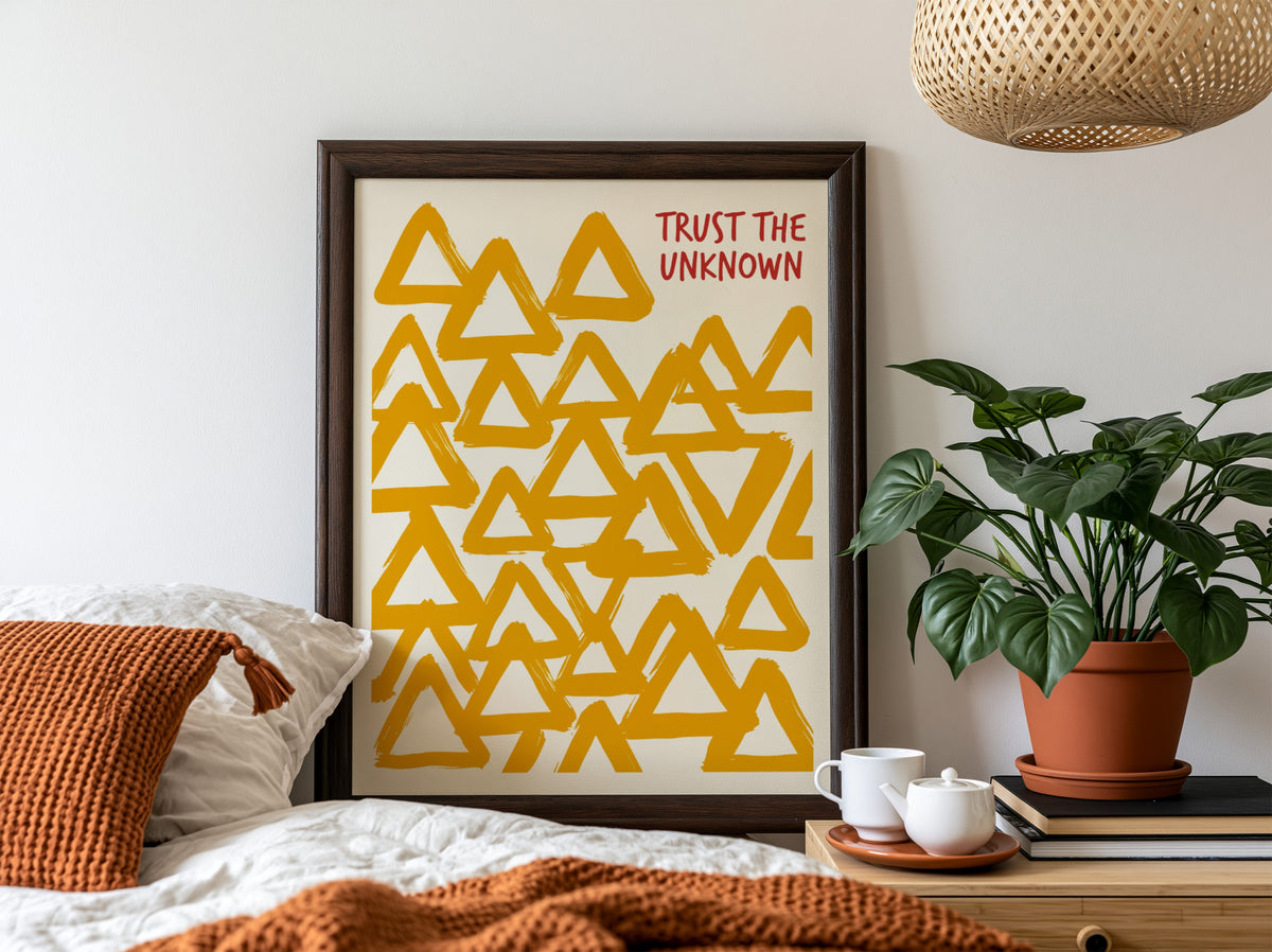 Motivational poster featuring hand-painted yellow triangles and the text Trust The Unknown above.