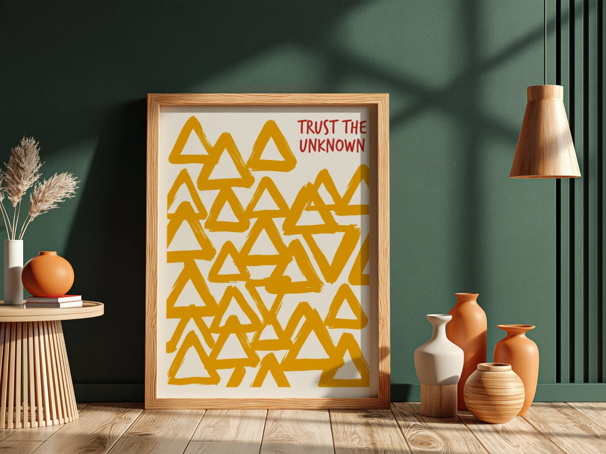Motivational poster featuring hand-painted yellow triangles and the text Trust The Unknown above.