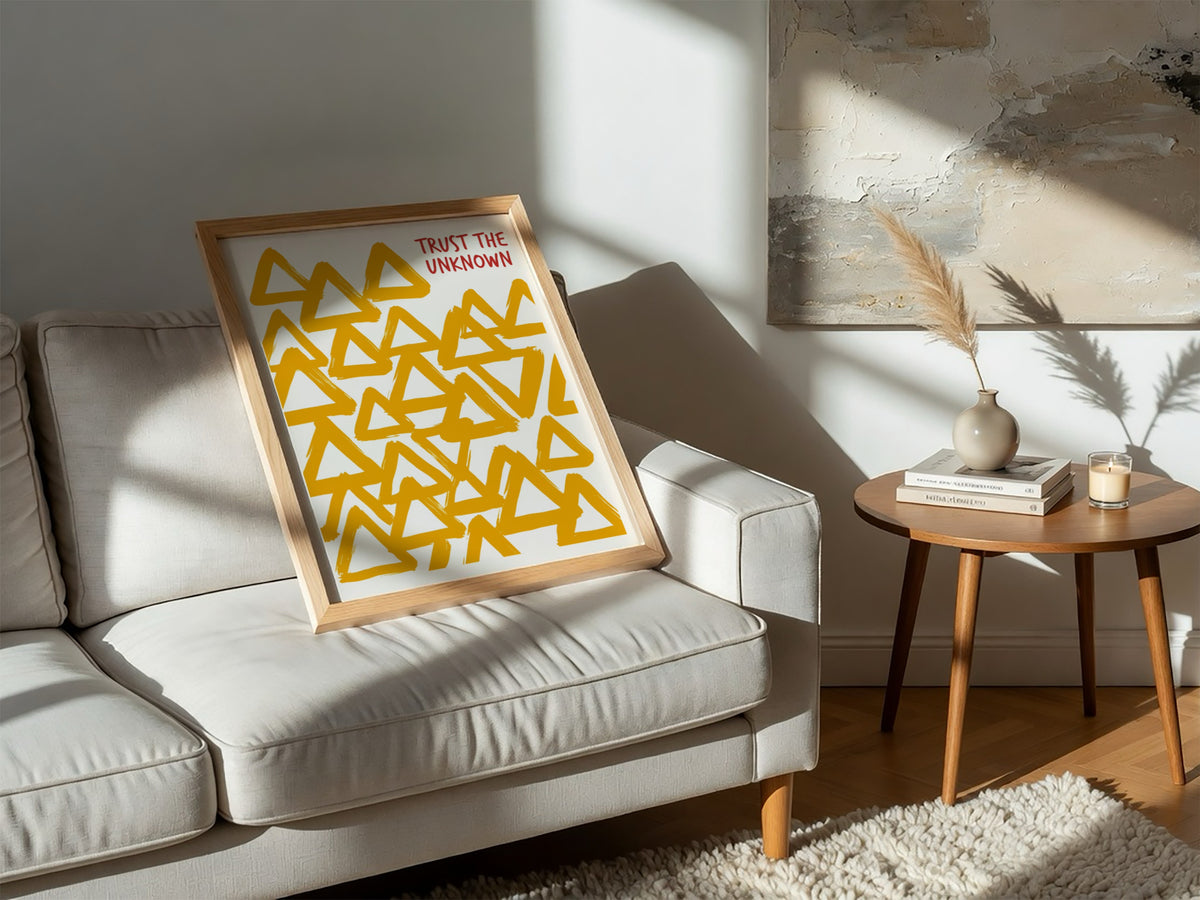 Motivational poster featuring hand-painted yellow triangles and the text Trust The Unknown above.