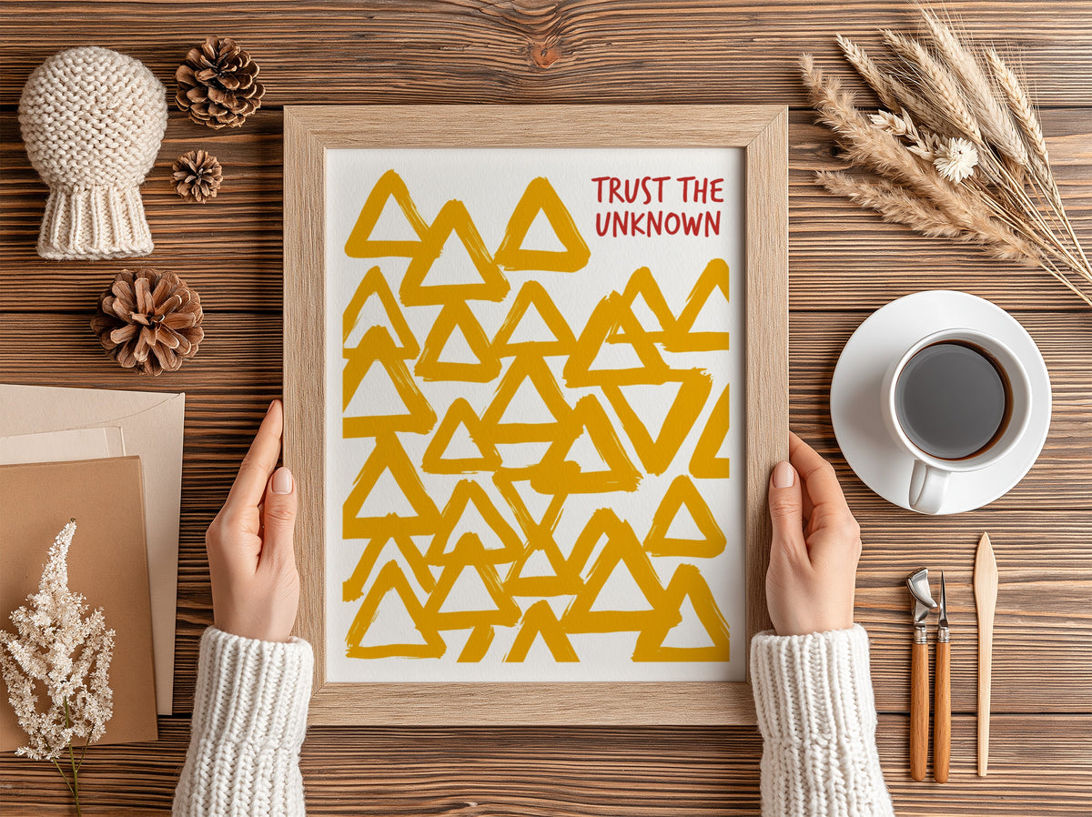 Motivational poster featuring hand-painted yellow triangles and the text Trust The Unknown above.
