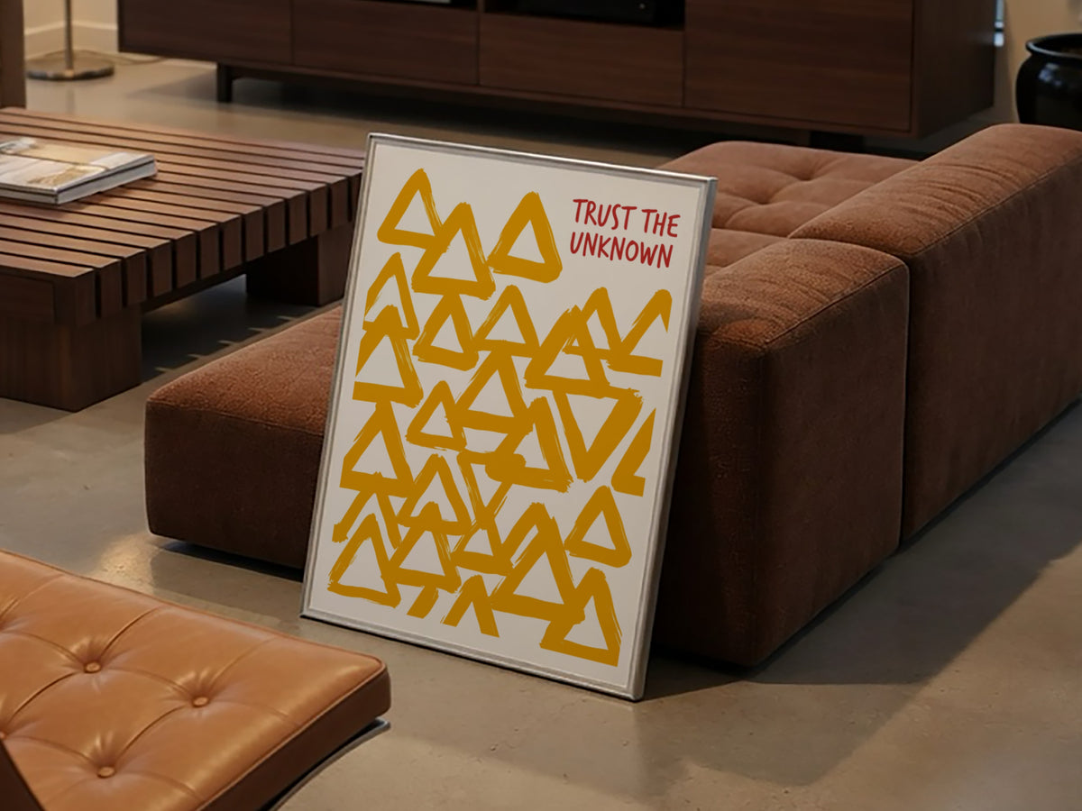 Motivational poster featuring hand-painted yellow triangles and the text Trust The Unknown above.