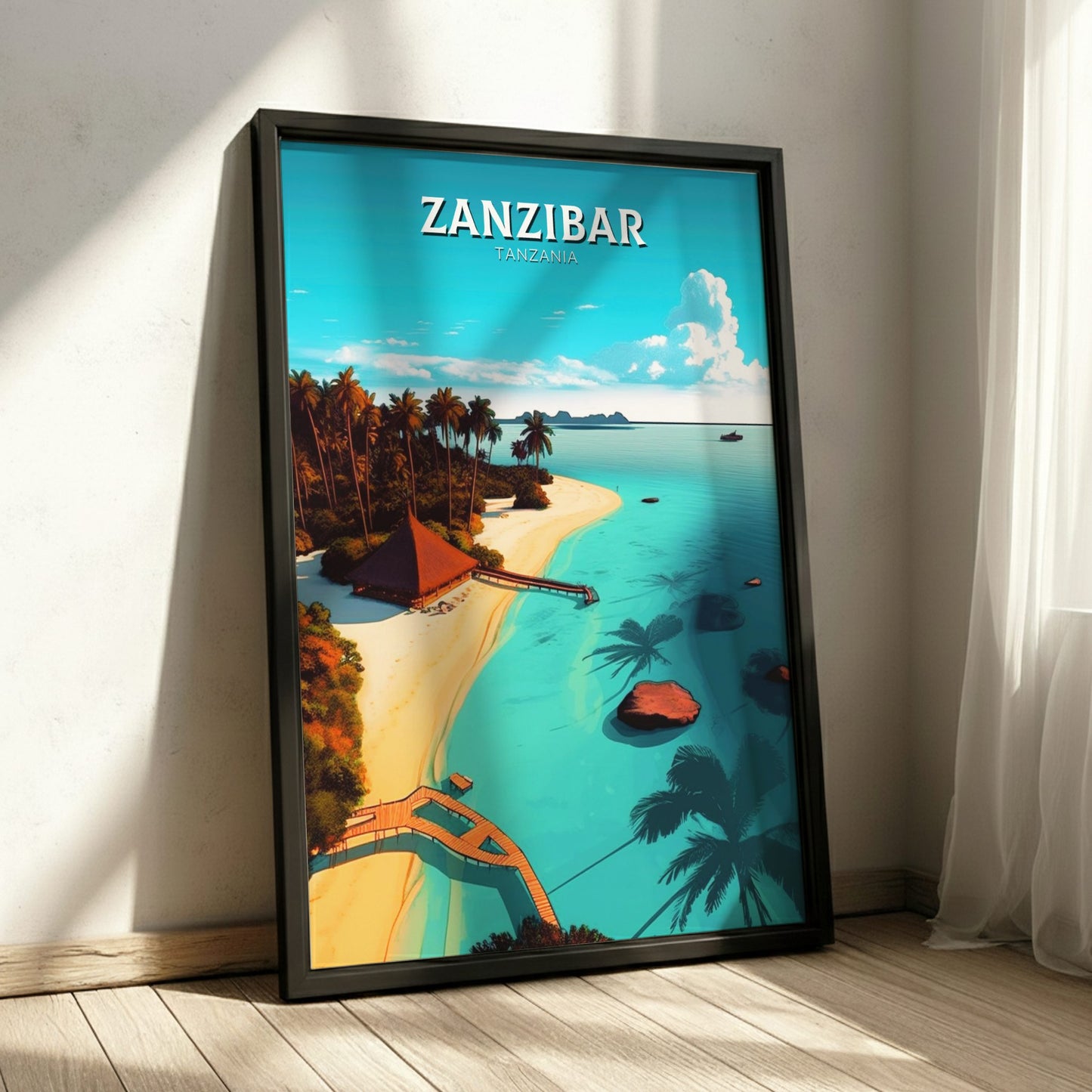 Framed poster of Zanzibar with a tropical beach scene on a wall.