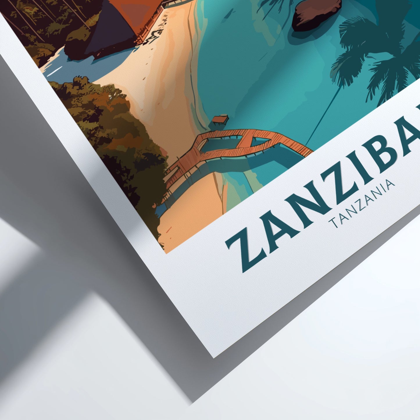 Framed artwork of a scenic view with 'Zanzibar, Tanzania' text.