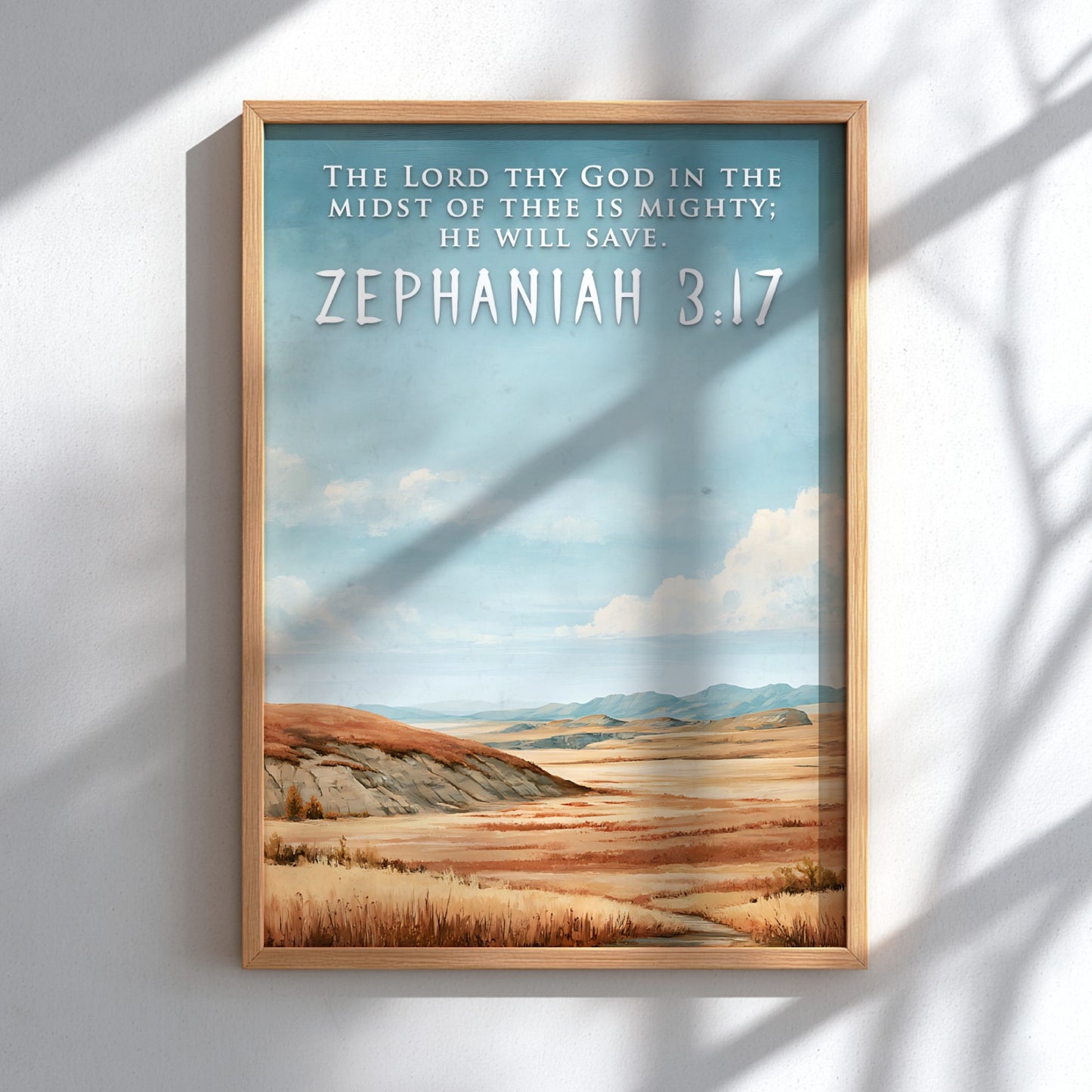 Poster featuring a golden prairie landscape under a blue sky with Zephaniah 3:17 text.