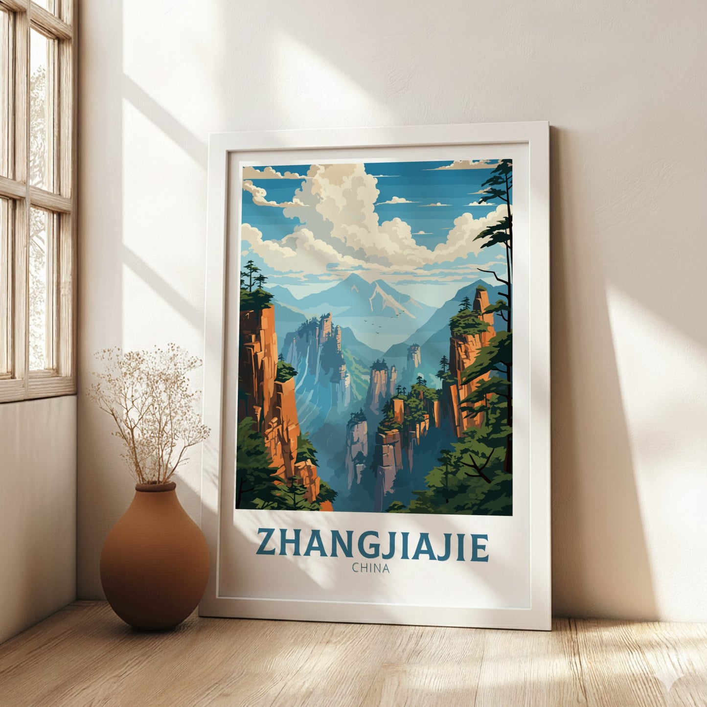 Framed poster of Zhangjiajie, China with scenic landscape, placed on a wall in a bright room.