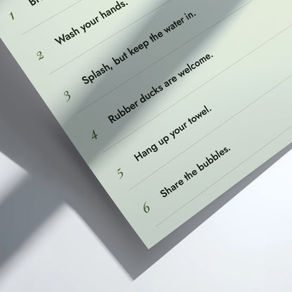 A close-up of a printed instruction sheet showing numbered bubble-bubble instructions, photographed on a clean white surface with soft shadows.