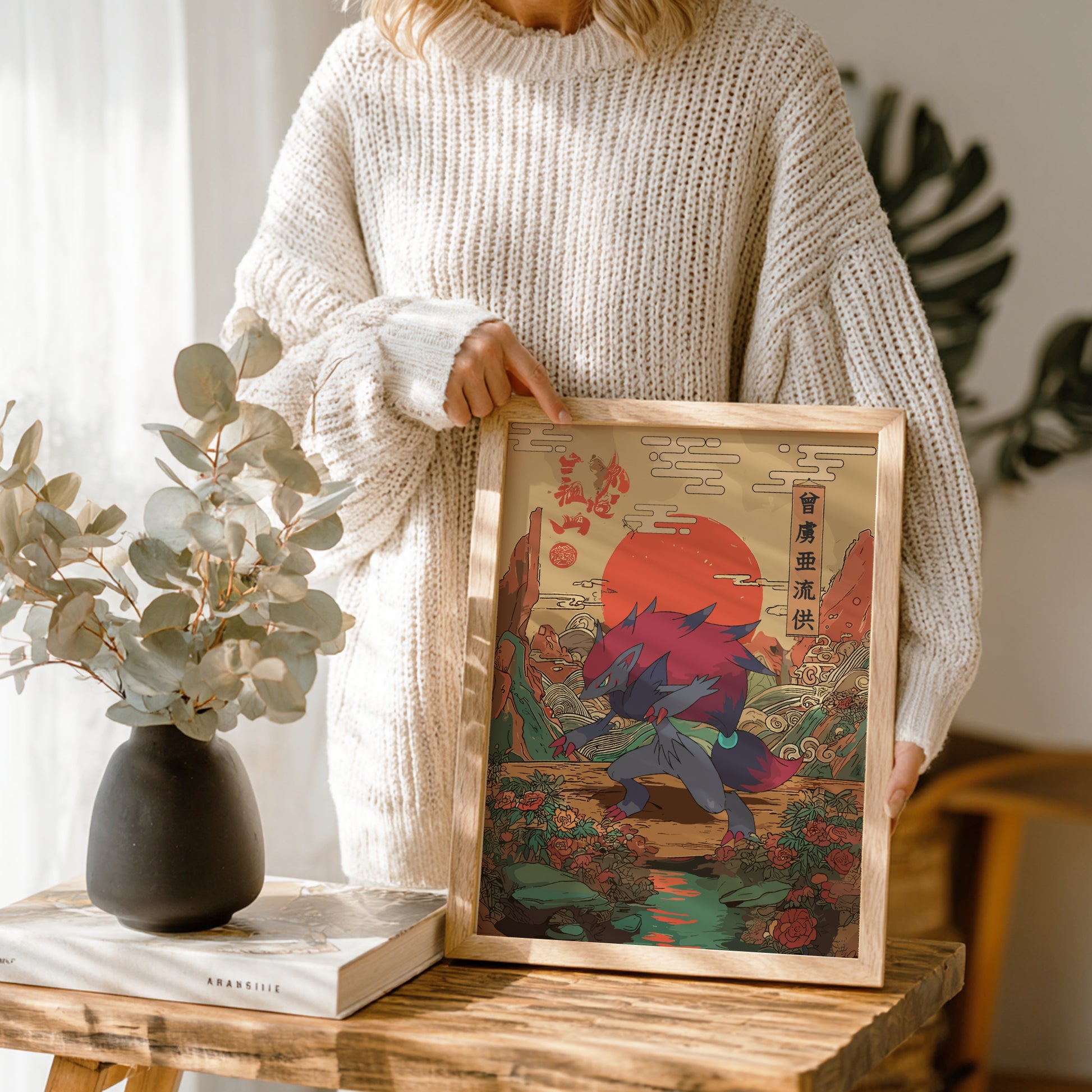 Person holding a framed artwork of a Zoroark Pokemon in a natural setting