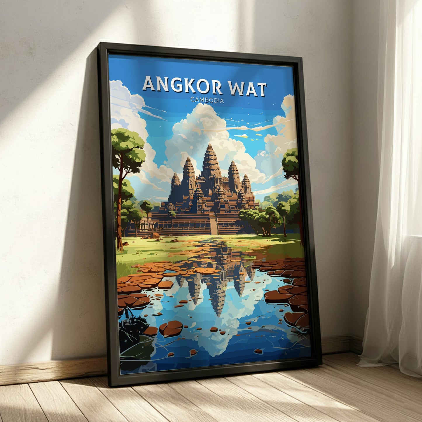 Framed poster of Angkor Wat in Cambodia on a wall.