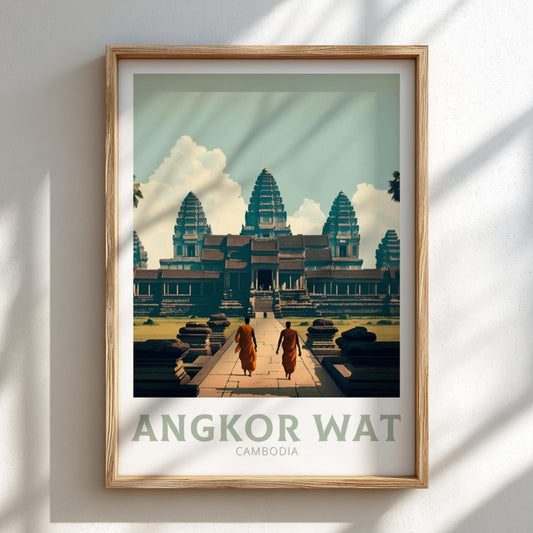 Framed poster of Angkor Wat with two monks walking towards it on a light gray wall.