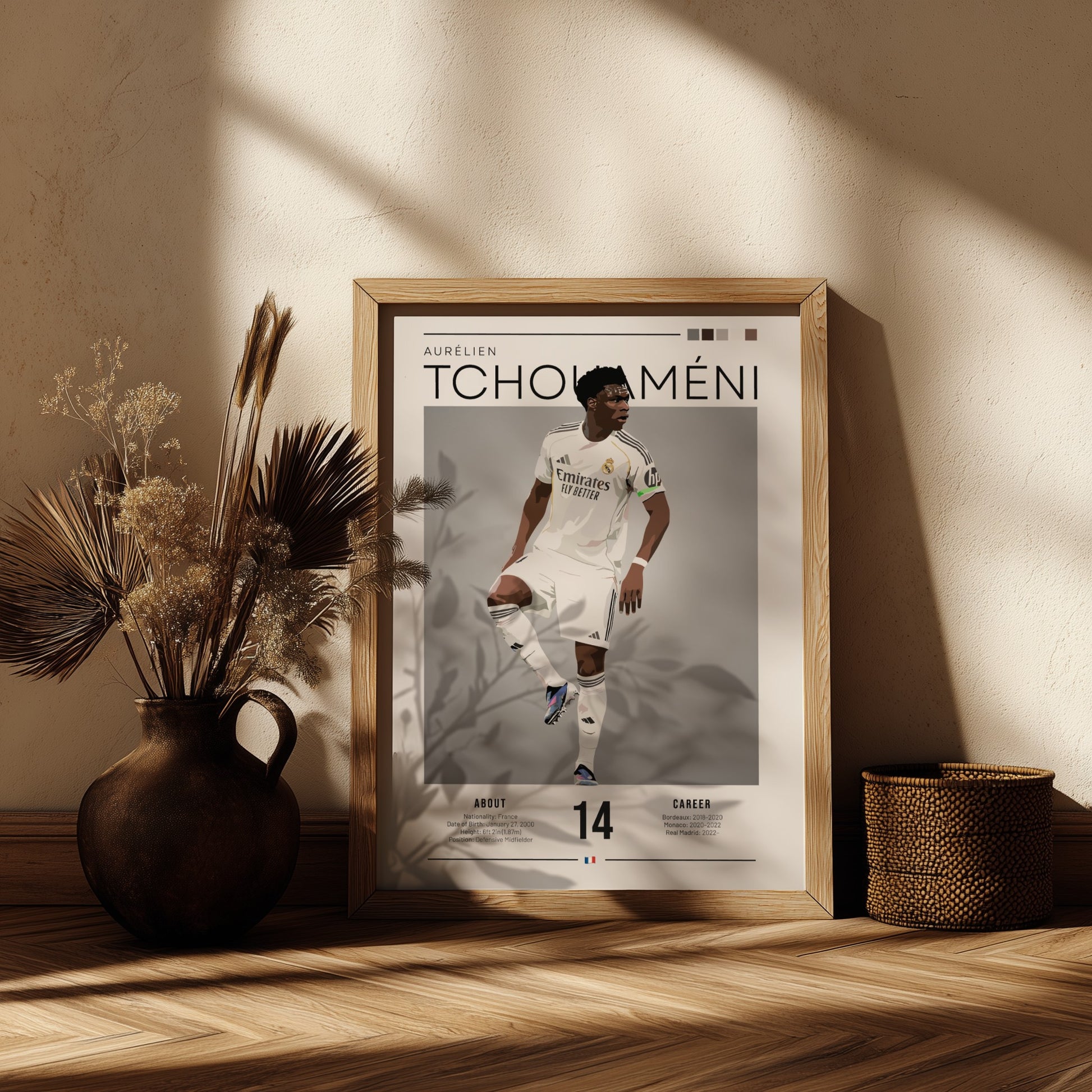 Real Madrid player poster featuring Aurélien Tchouaméni in a dynamic pose with a sleek color palette