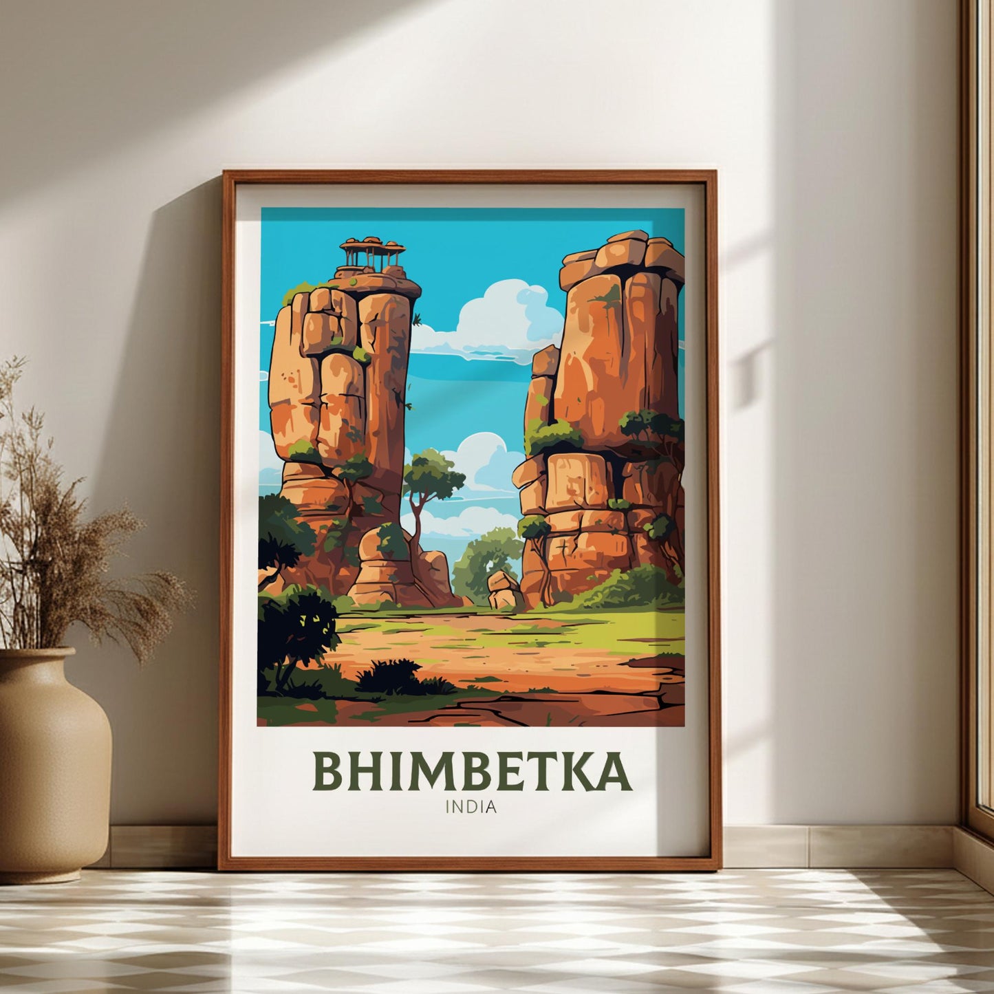 Framed poster of Bhimbetka, India with rock formations and trees on a wall.