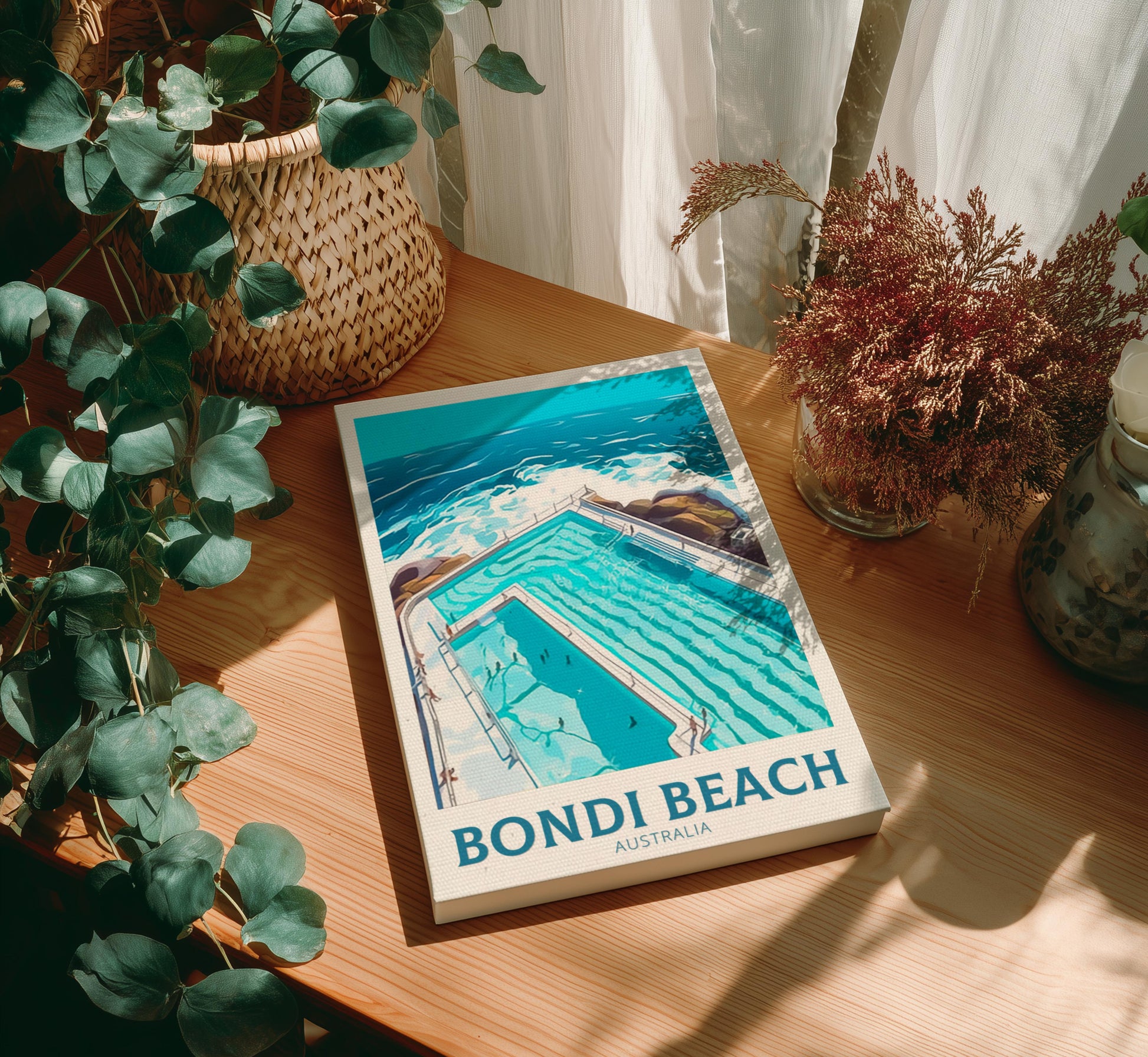 Canvas of 'Bondi Beach, Australia' on a wooden table with plants around