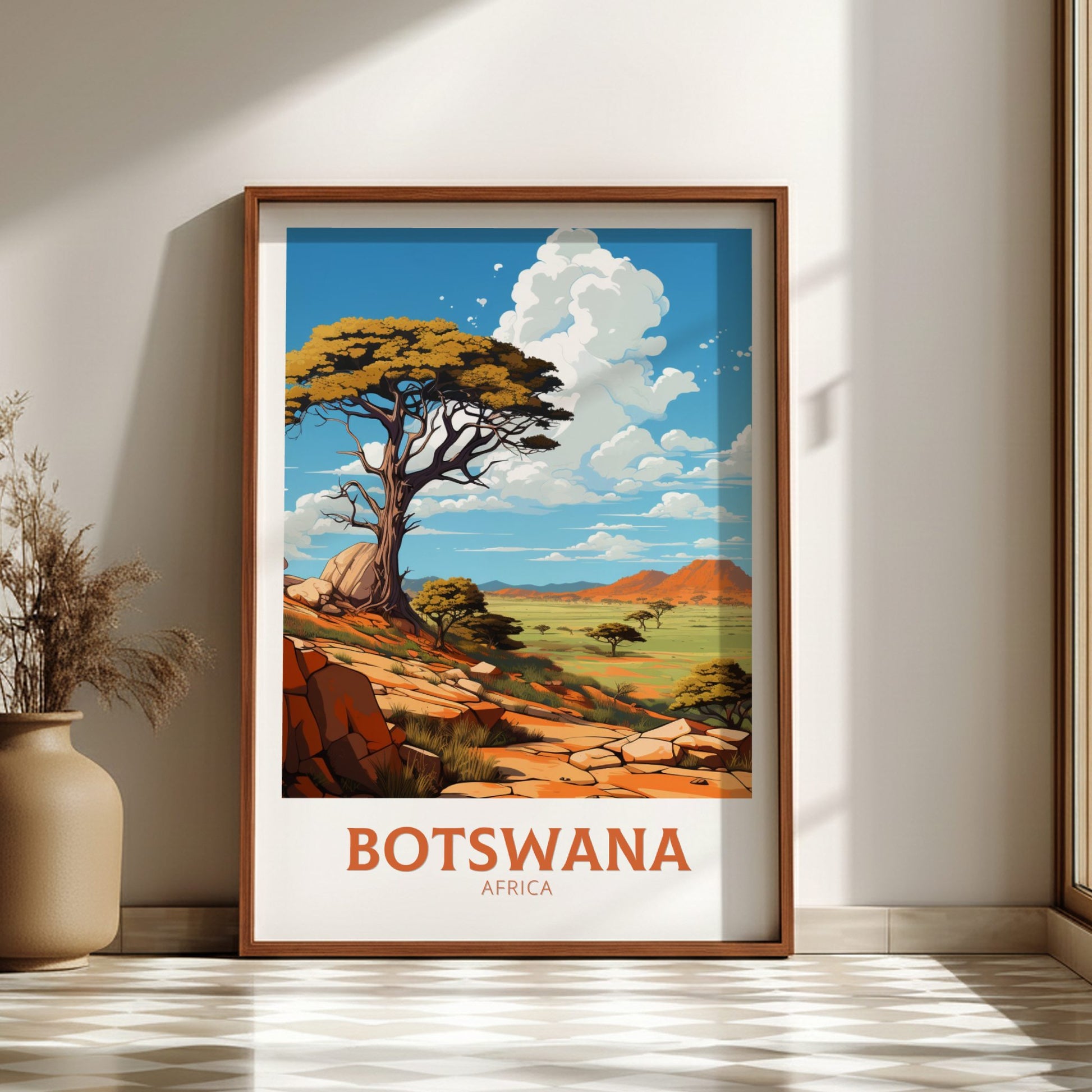 Framed artwork of Botswana landscape with acacia tree and rocky terrain.