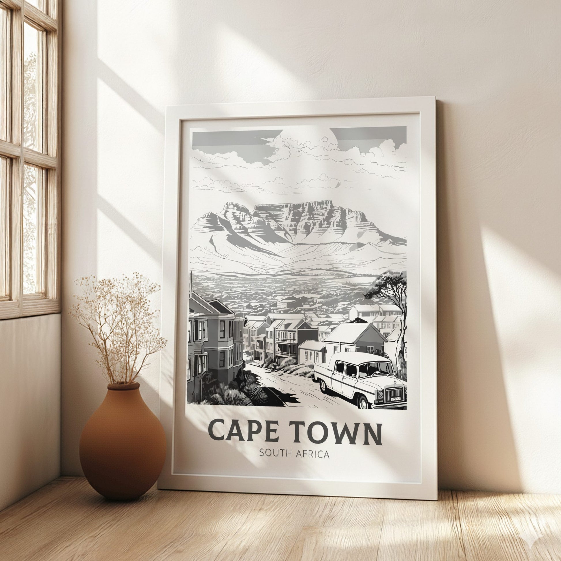 Framed artwork of Cape Town, South Africa, in a room with natural light.