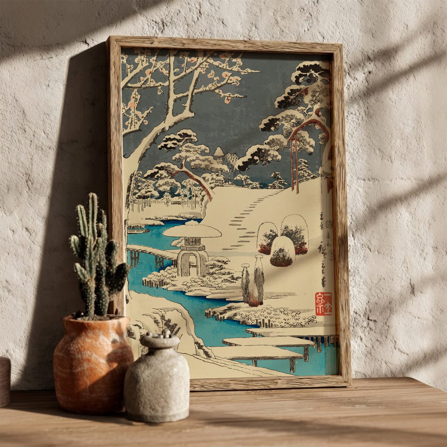 Japanese art poster of plum blossoms in snow, featuring a stone lantern and a blue river in Ukiyo-e style.