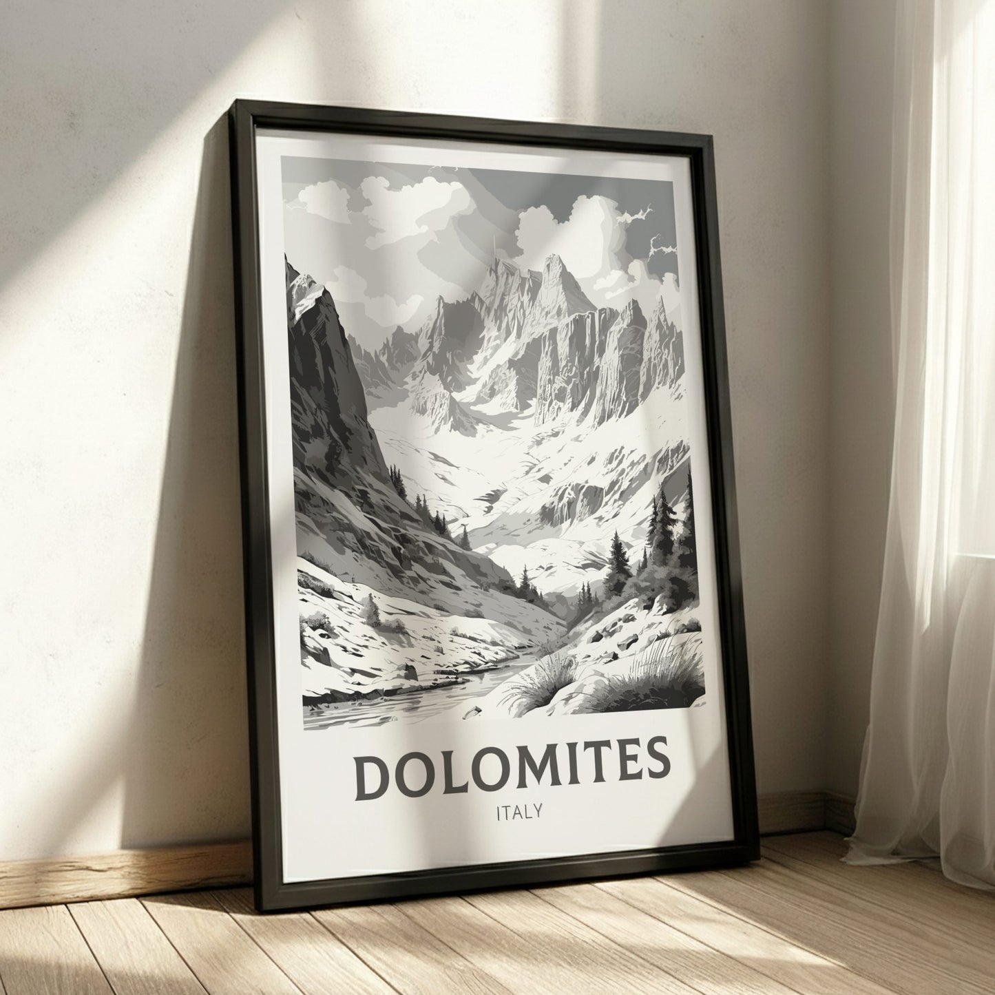 Framed poster of the Dolomites mountains in a room with sunlight casting shadows.