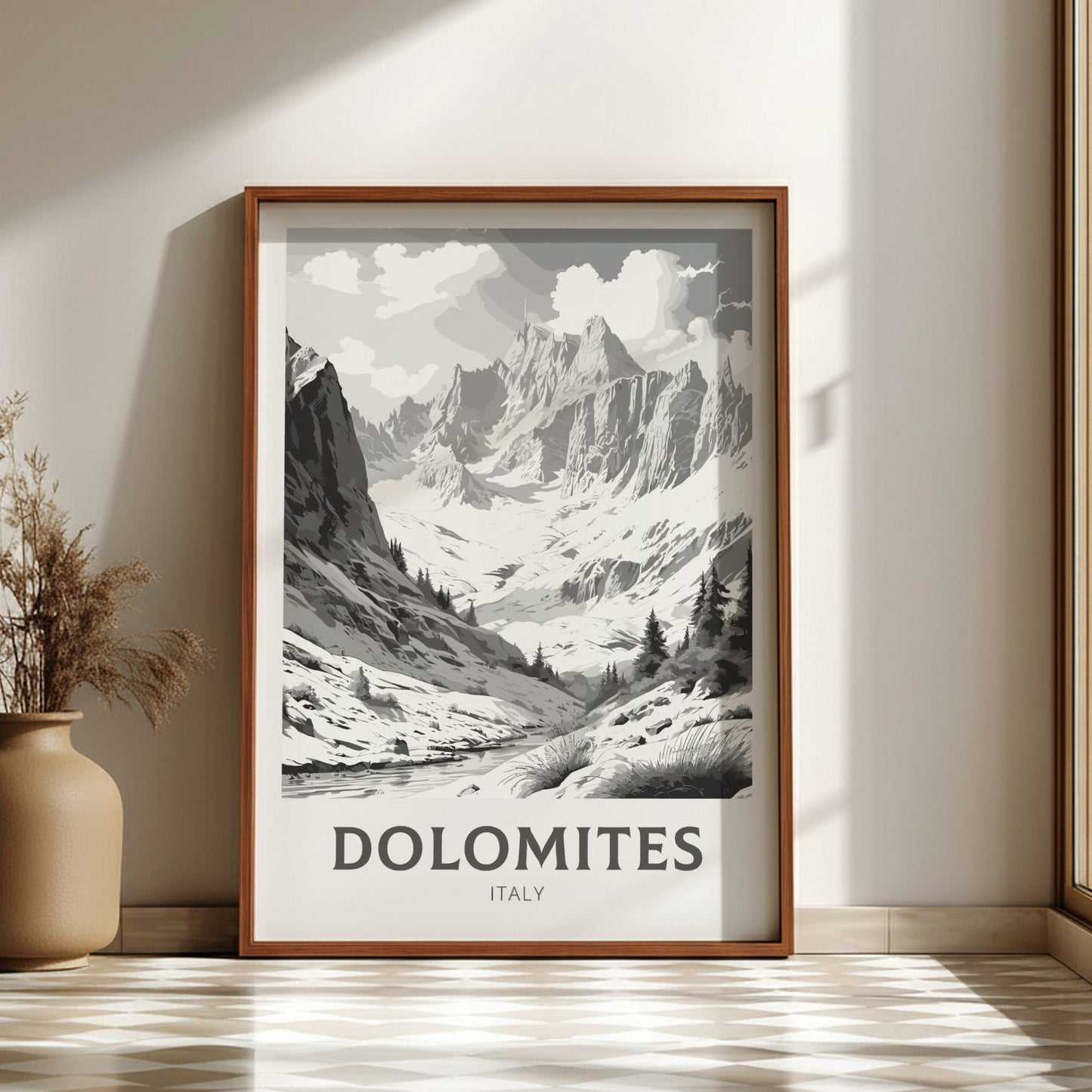 Framed print of the Dolomites mountains in Italy on a wall.