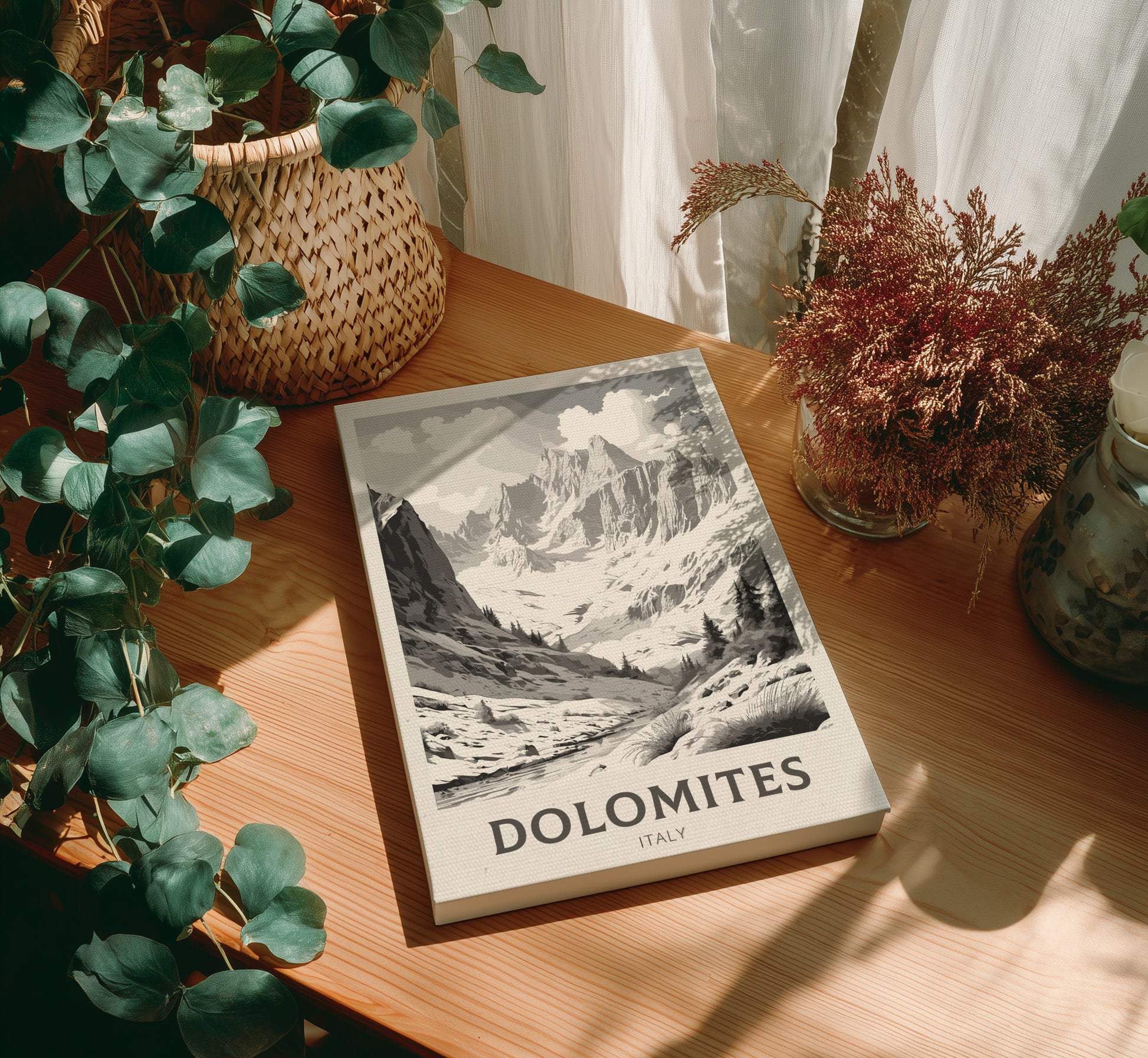Canvas 'Dolomites' on a wooden table with plants around