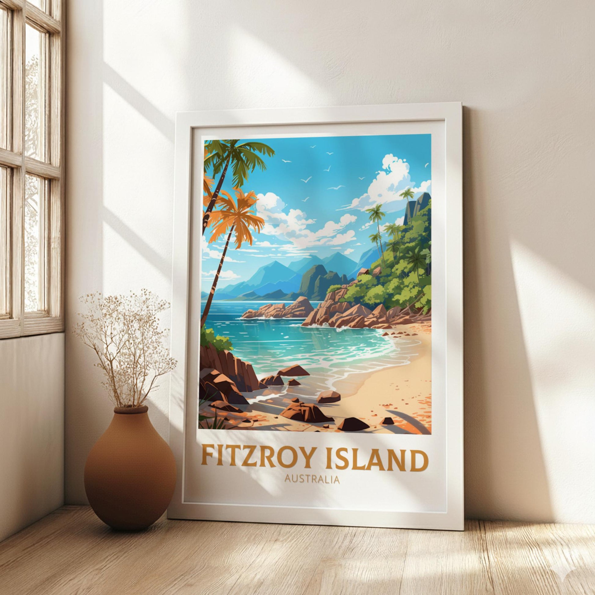Framed artwork of Fitzroy Island, Australia, on a wall with natural light.
