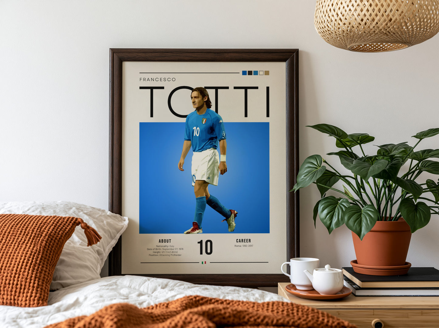 Francesco Totti poster featuring vibrant blue jersey and dynamic pose, celebrating Italian football legend.
