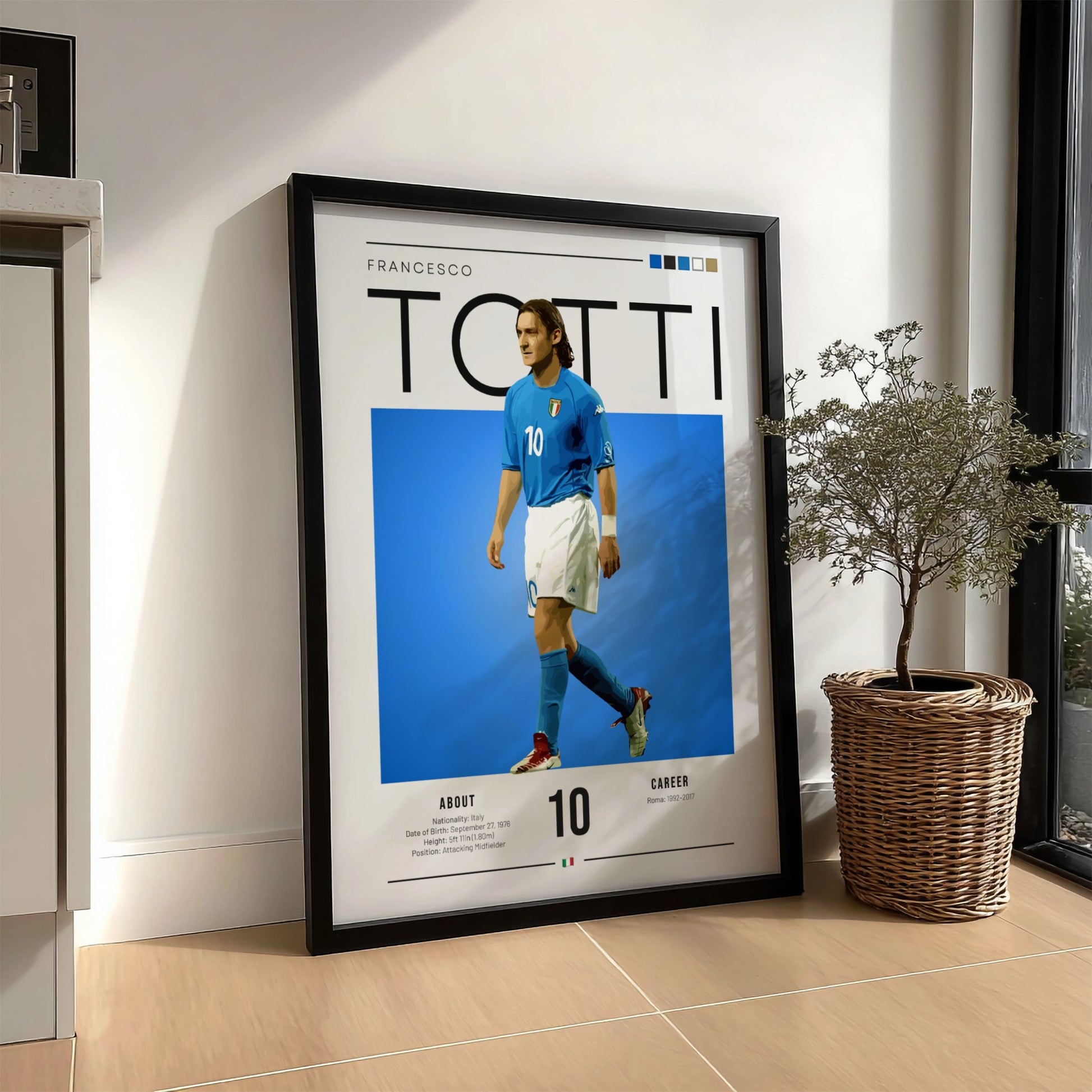 Francesco Totti poster featuring vibrant blue jersey and dynamic pose, celebrating Italian football legend.