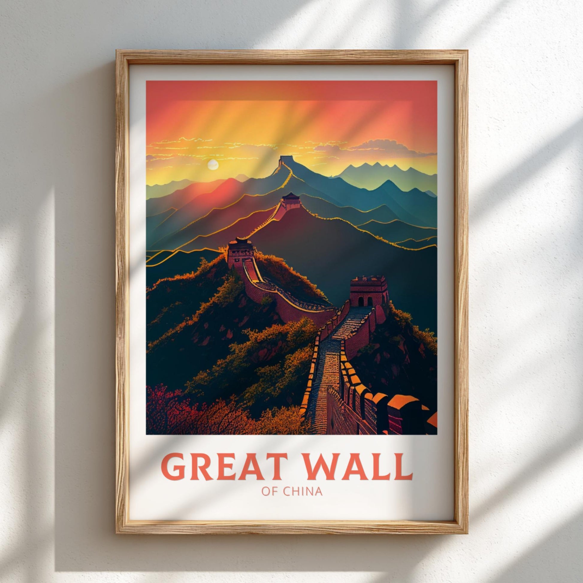 Framed artwork of the Great Wall of China with a colorful sunset background.