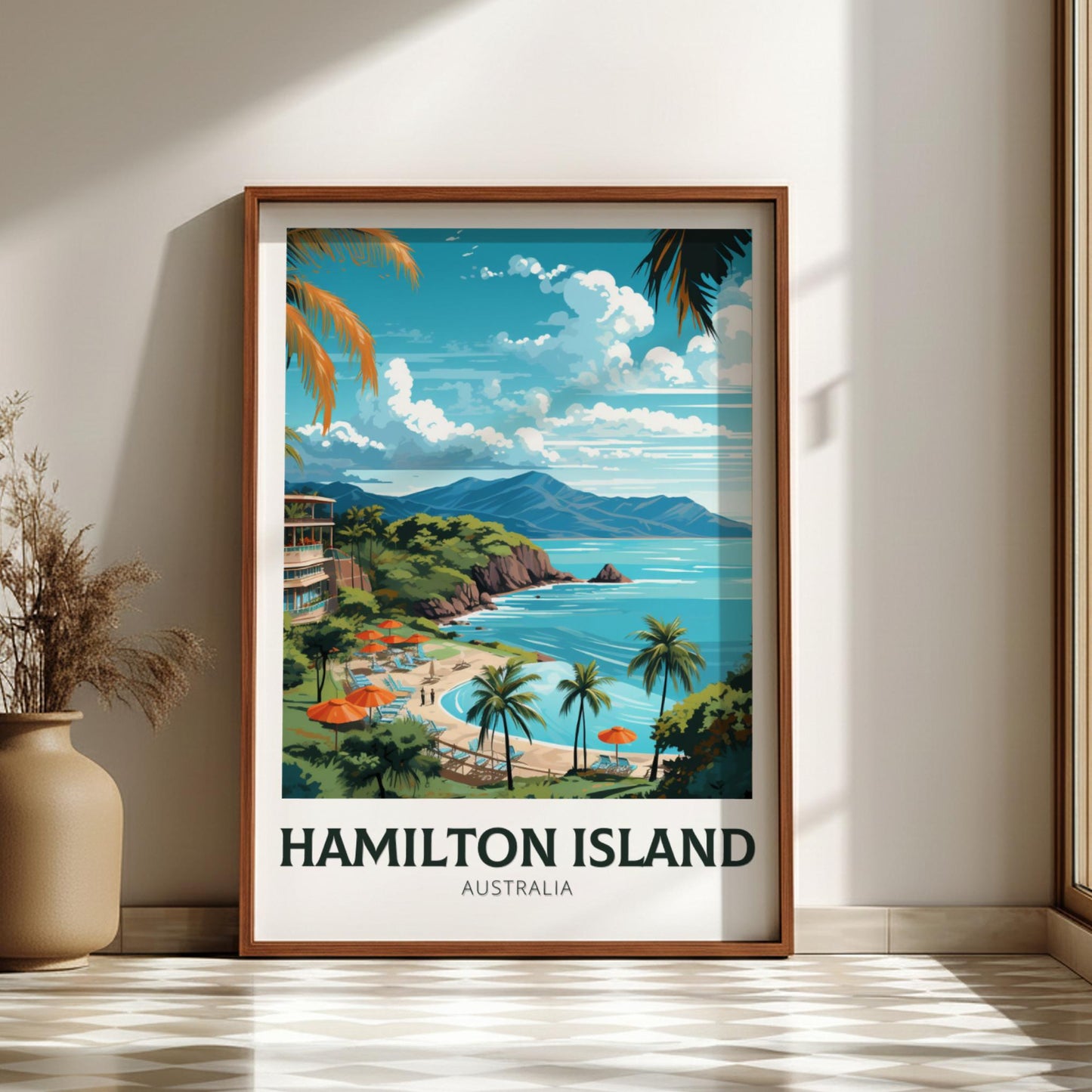 Framed artwork of Hamilton Island, Australia, on a wall with a vase and plant.