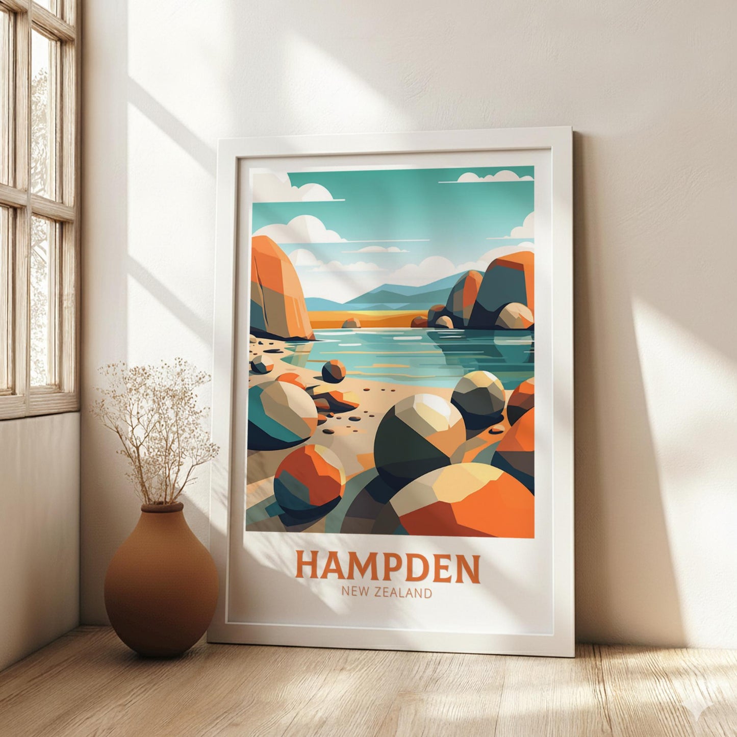 Framed poster of Hampden, New Zealand with colorful landscape design on a wall.