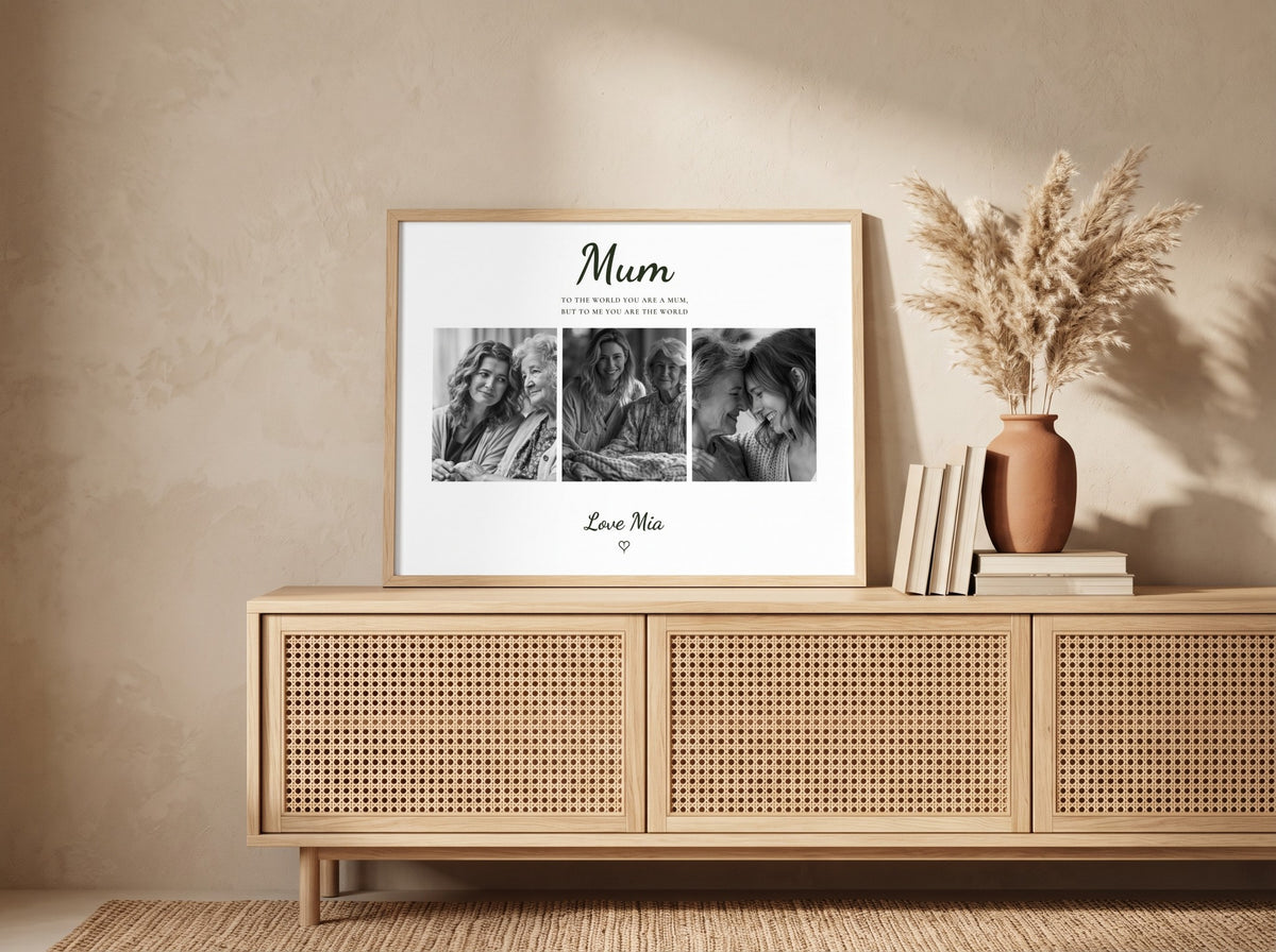 A framed personalized photo print with the word 'Mum' at the top and three black-and-white portrait photos, styled on a light wood cabinet beside books and a vase with dried grass in a warm neutral room.