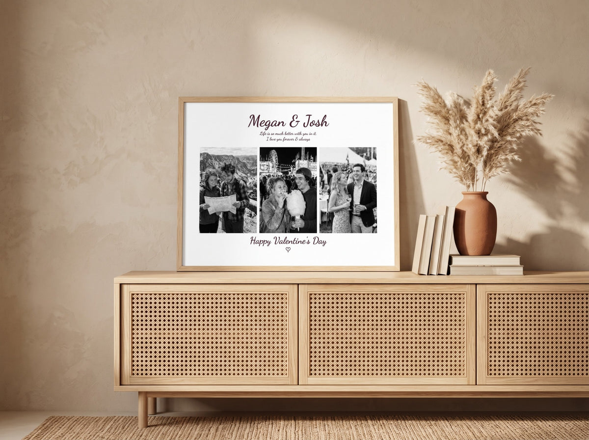 A framed personalized Valentine's Day photo print with black-and-white wedding photos and the names Megan & Josh, styled on a light wood console against a textured beige wall.