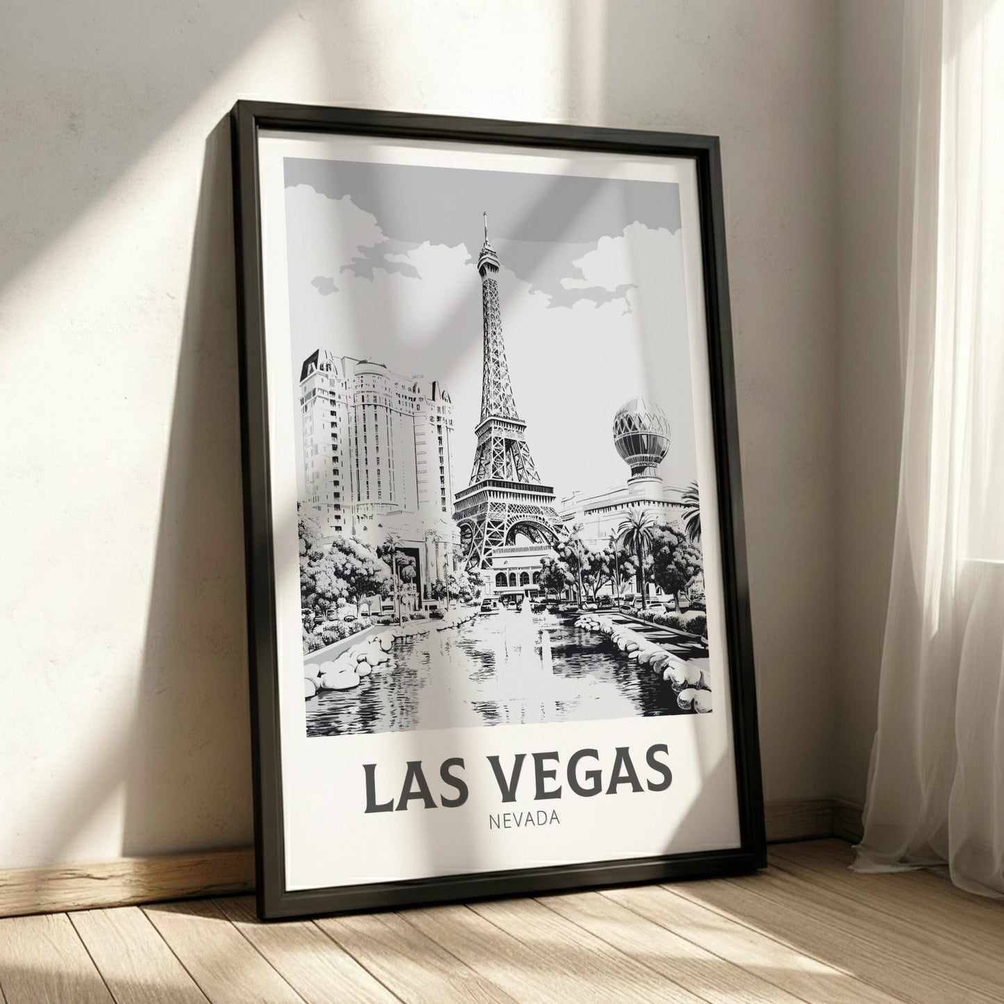 Framed poster of Las Vegas with Eiffel Tower design on a wall.