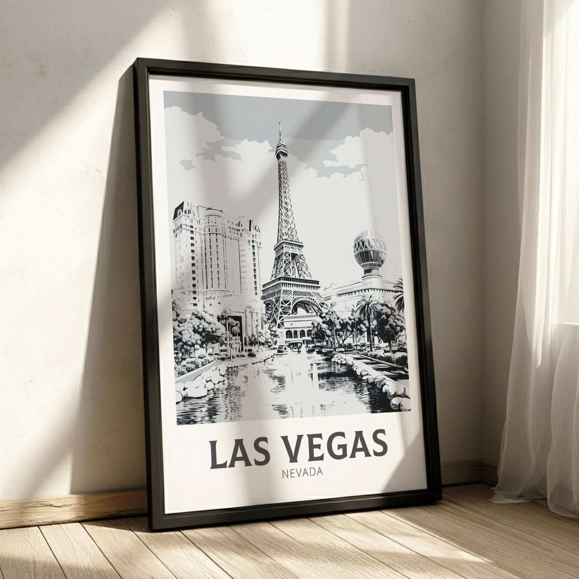 Framed poster of Las Vegas with Eiffel Tower design on a wall.