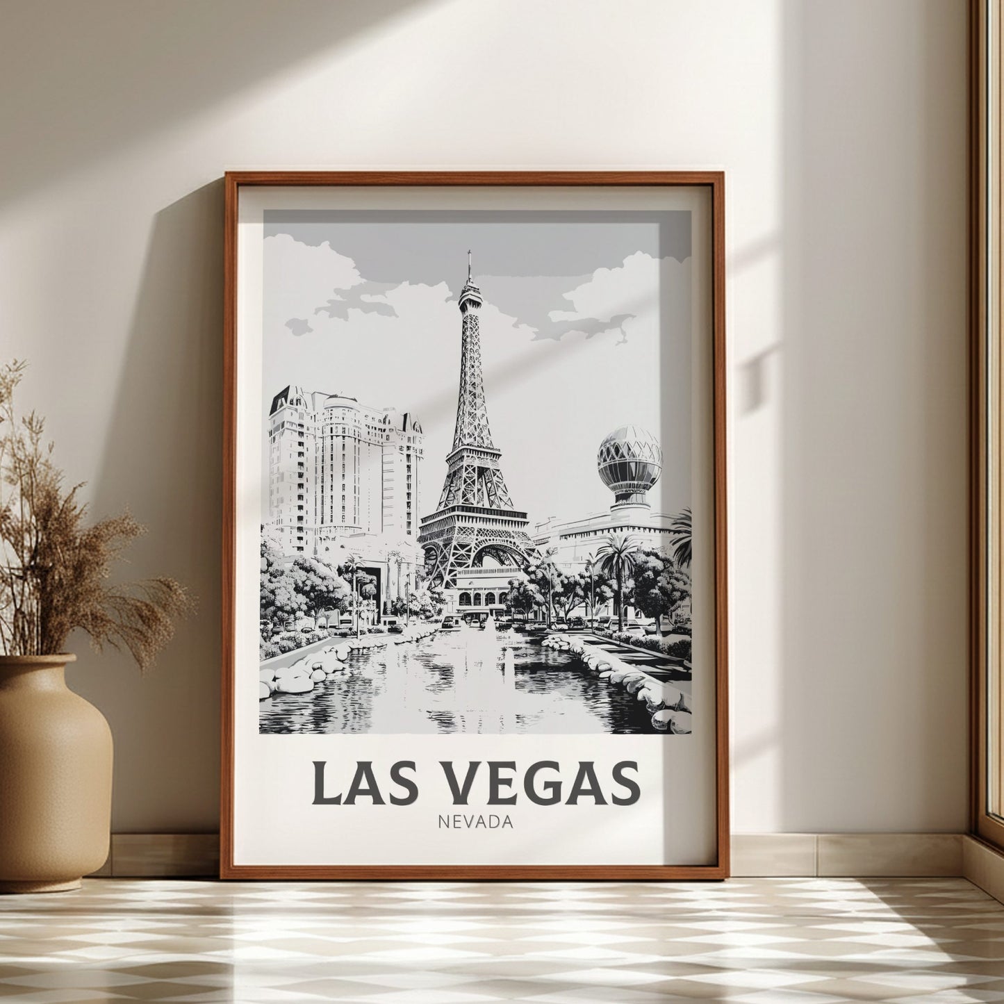 Framed poster of Las Vegas with Eiffel Tower design on a wall.