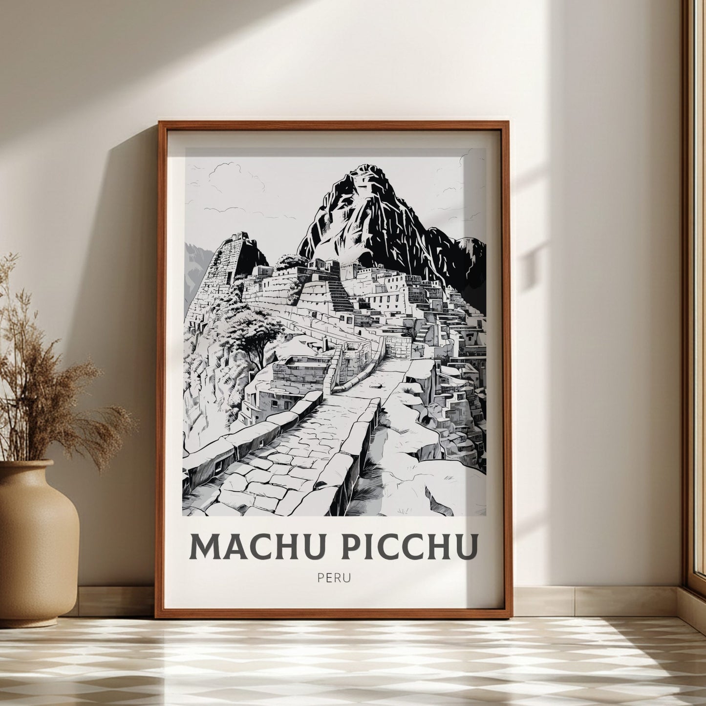 Framed poster of Machu Picchu with a wooden frame on a wall.
