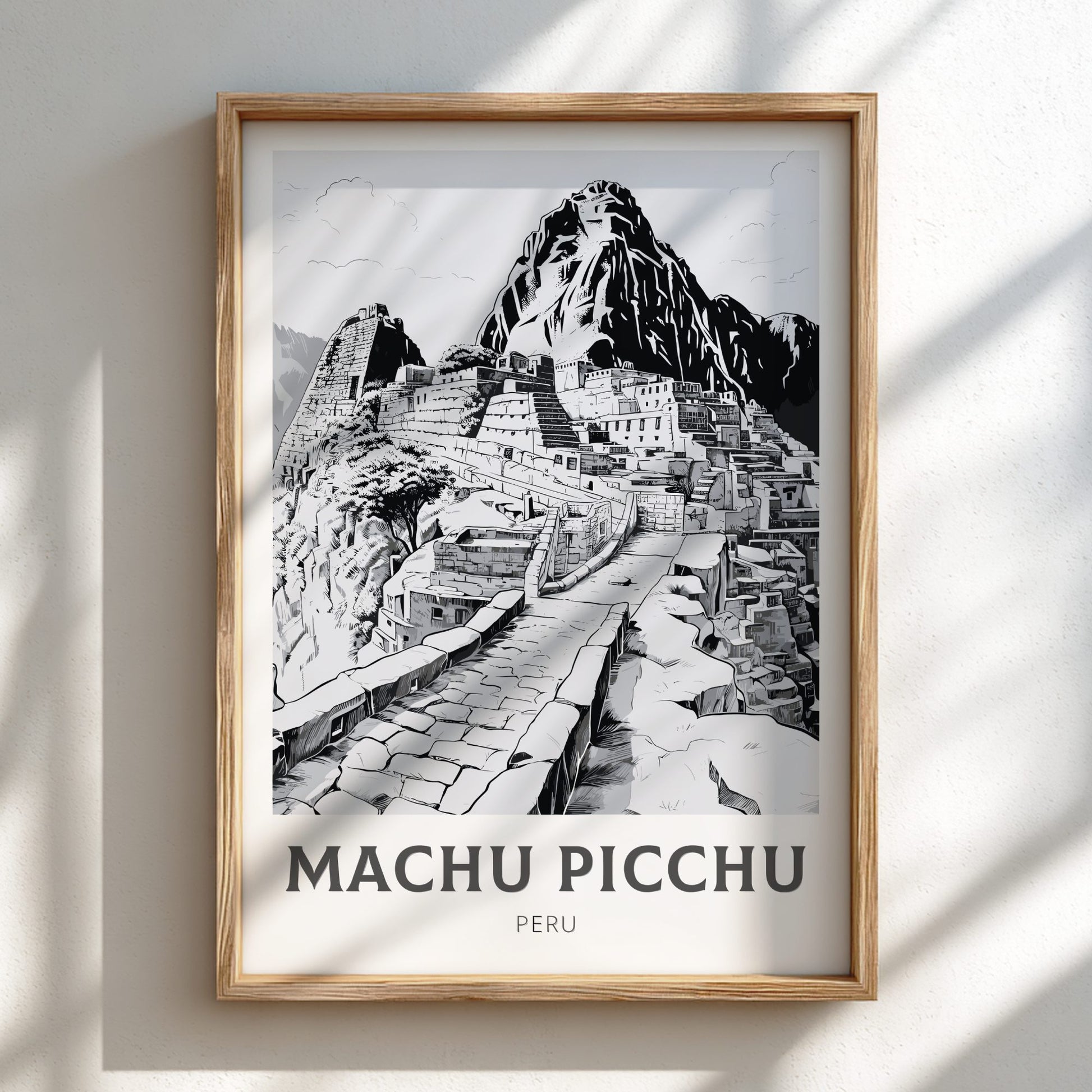 Framed artwork of Machu Picchu with a wooden frame on a light background