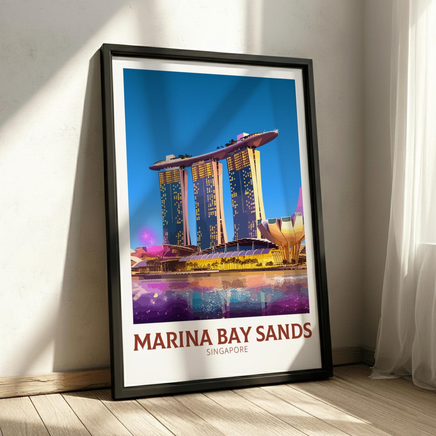 Framed poster of Marina Bay Sands in Singapore on a wall.