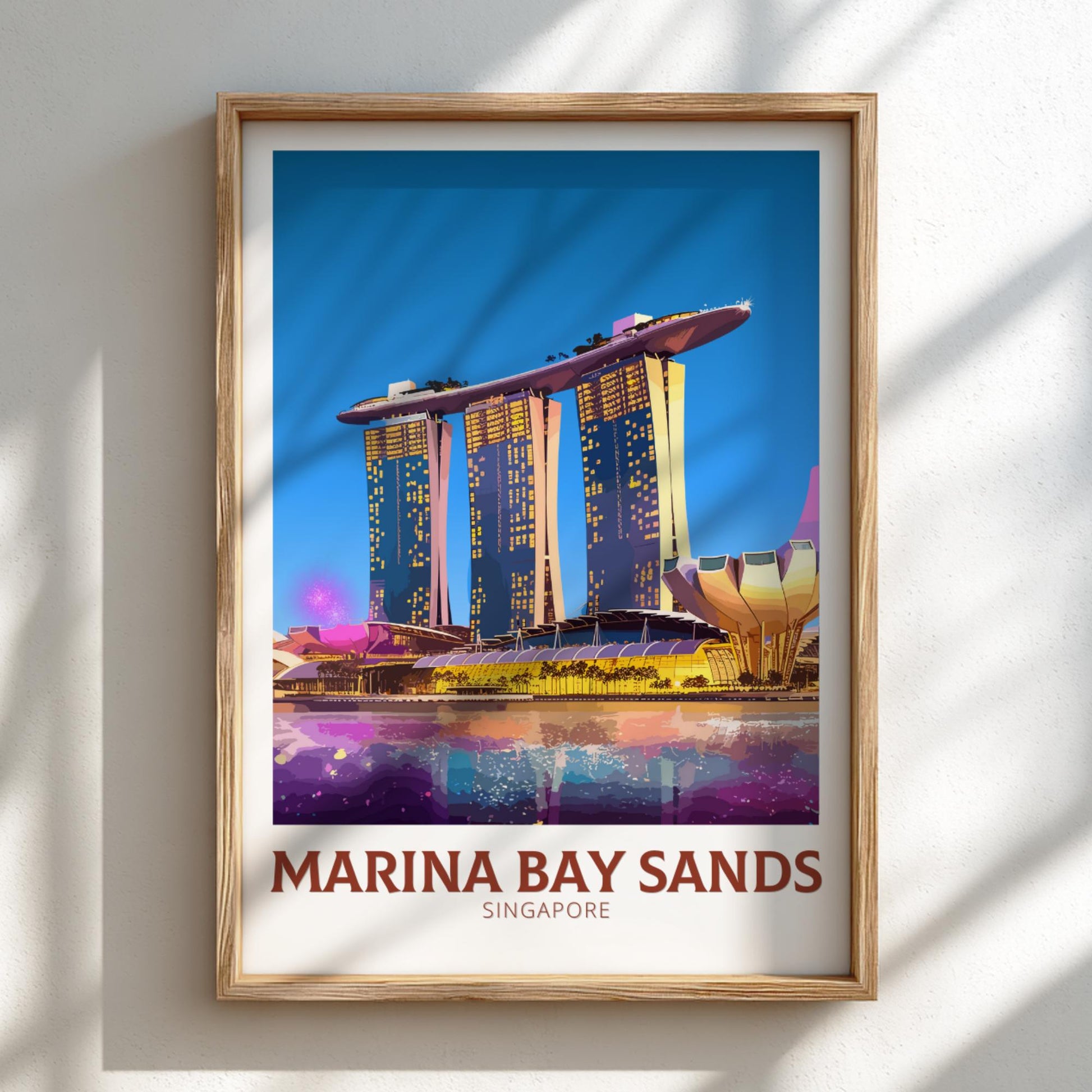 Framed poster of Marina Bay Sands in Singapore with a wooden frame on a light background